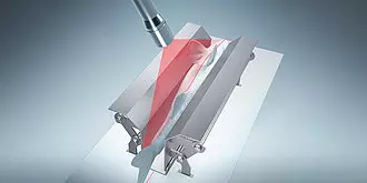 A medical device with a red and transparent component, possibly used for surgical procedures or medical testing.