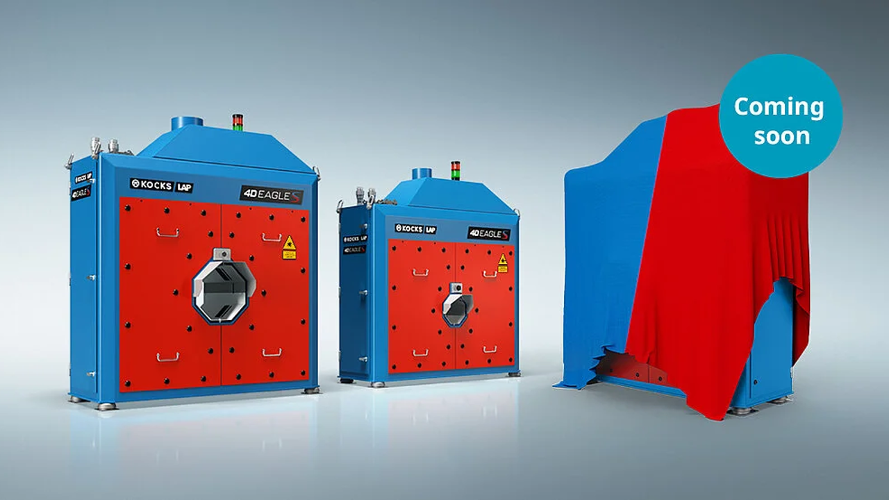 Three industrial machines, two are similar blue and red laser welding systems, and one is a covered piece of equipment with a blue and red cloth labeled "Coming soon."