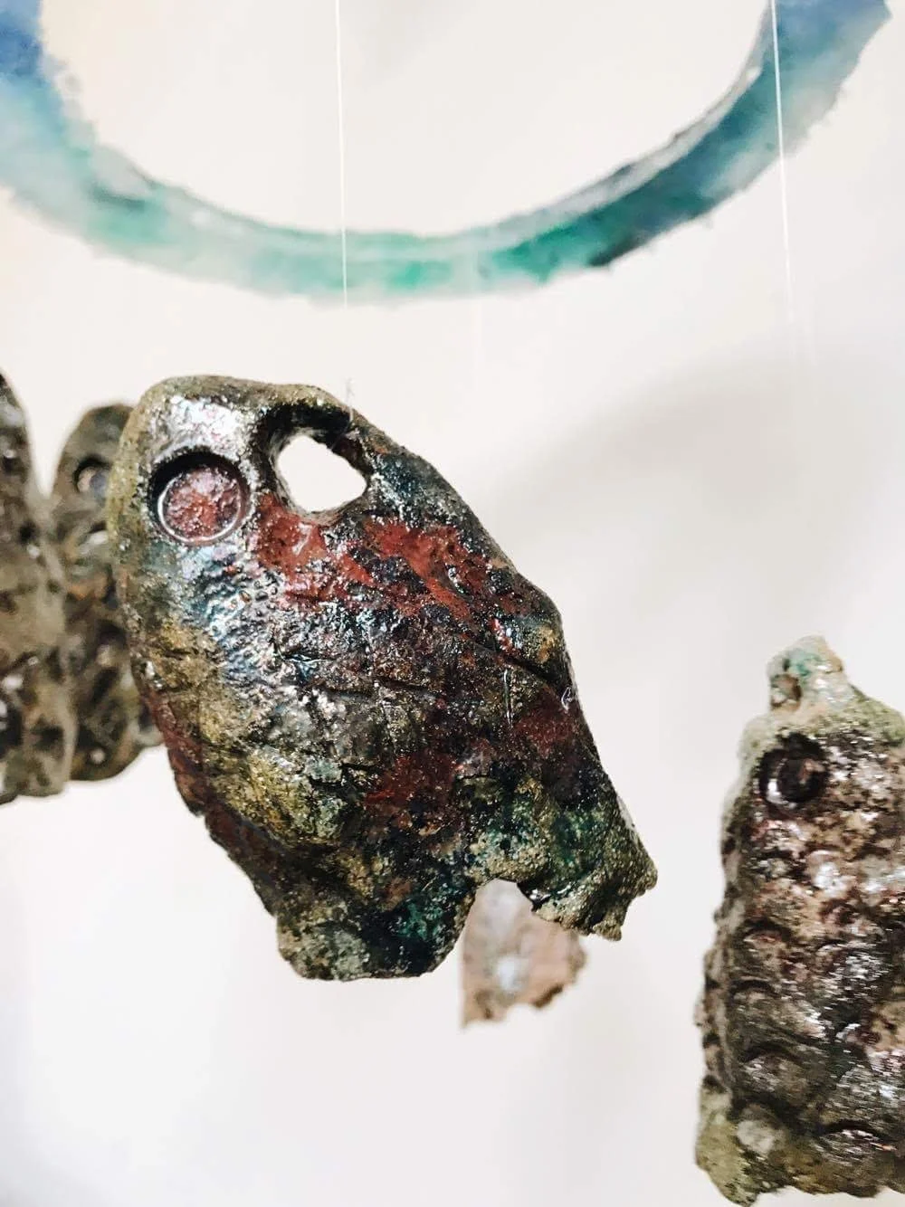 Archive, fish head mobile (ceramic raku fired and glass)