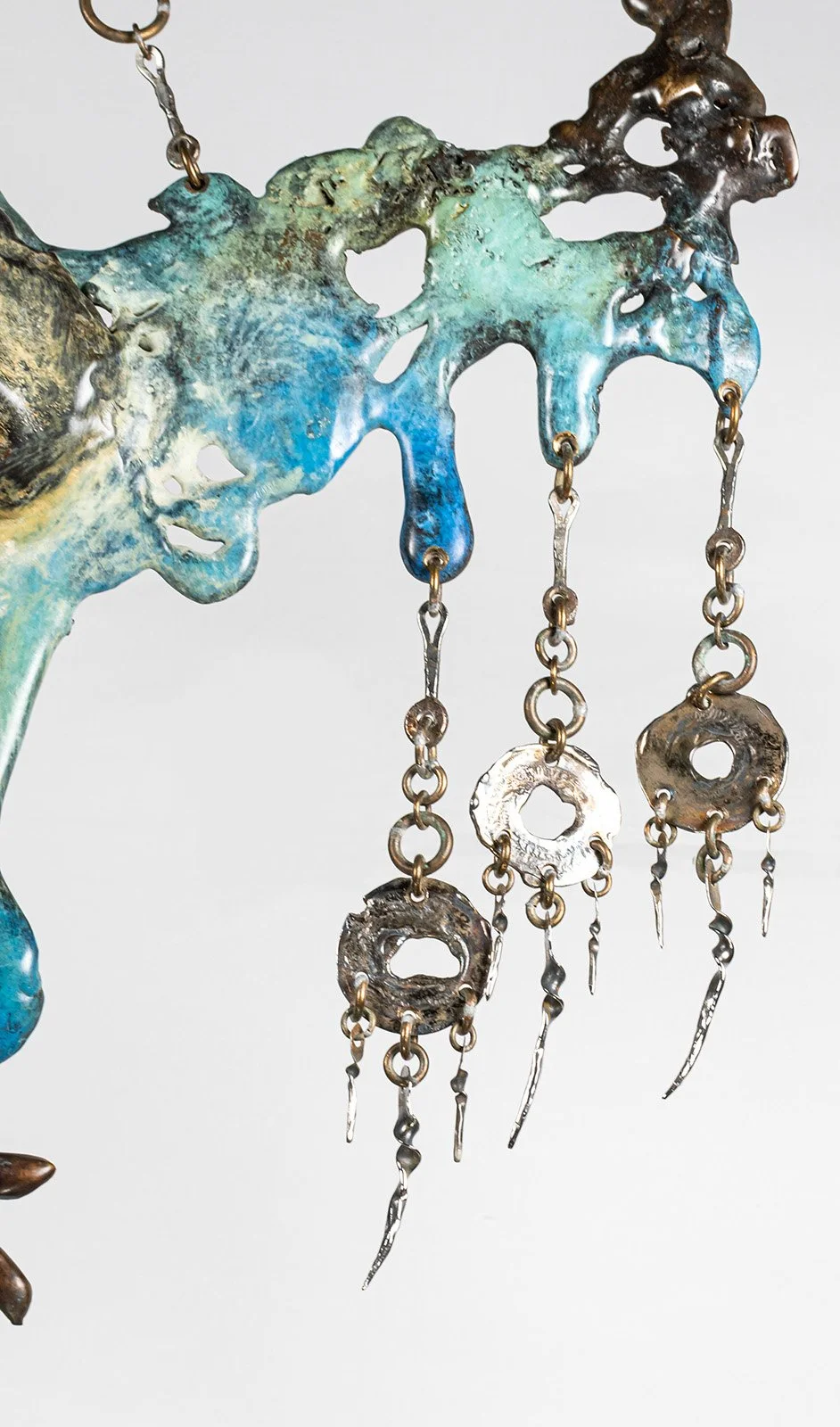 Each spike hangs free from its ring, hammered to shape one at a time, the way earrings are made.