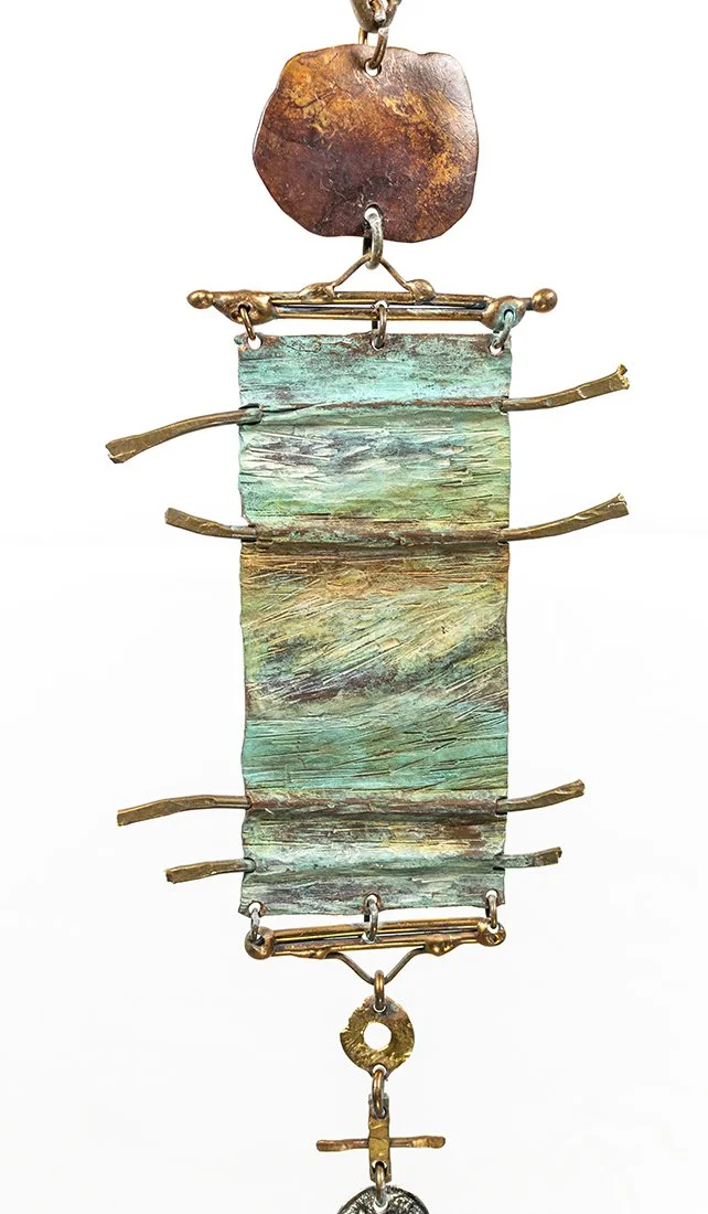 Brass rods cross the panel the way threads cross a loom, holding the field in tension.