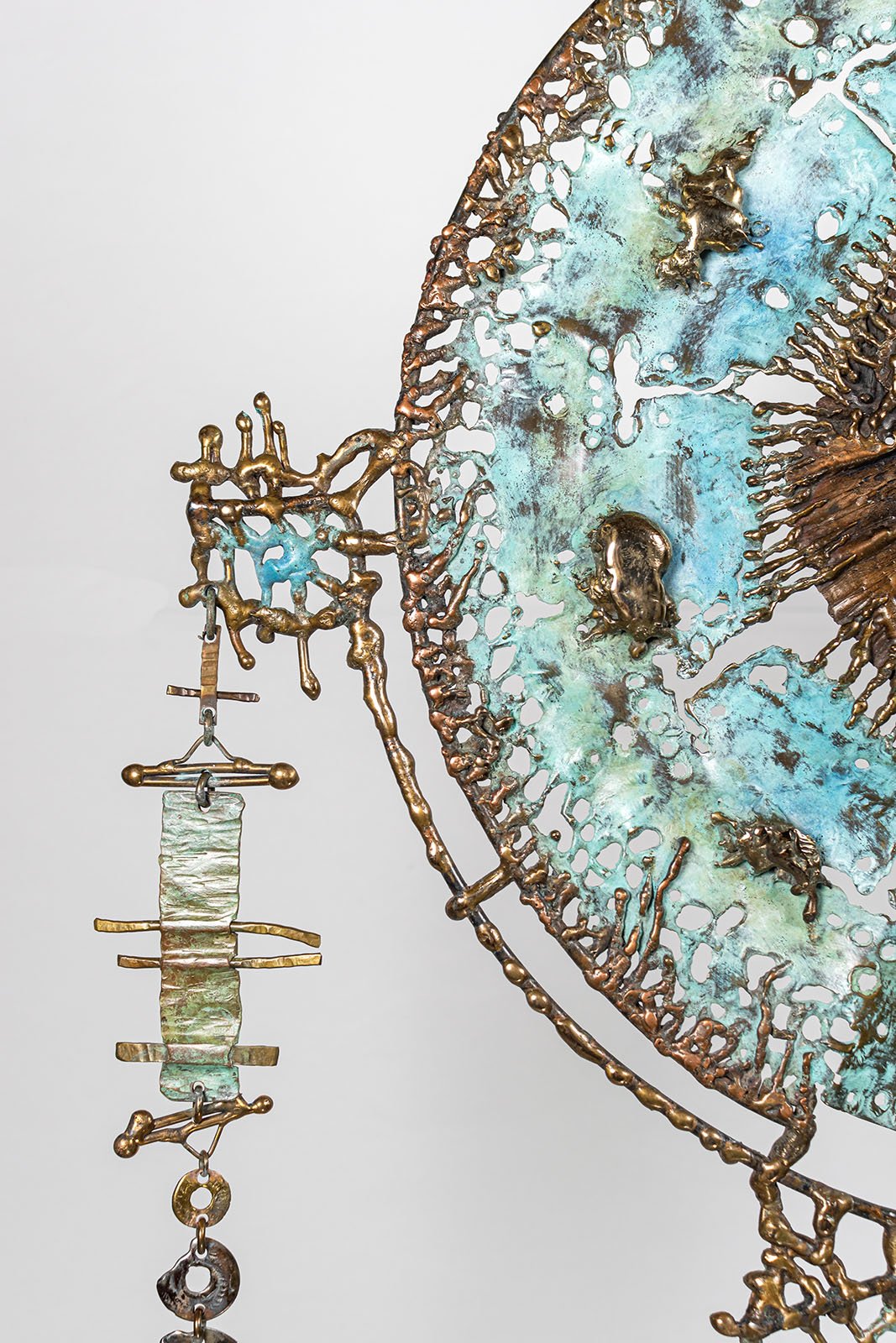 The outer edge worked as openwork lace in bronze, the structure that draws the shadow.