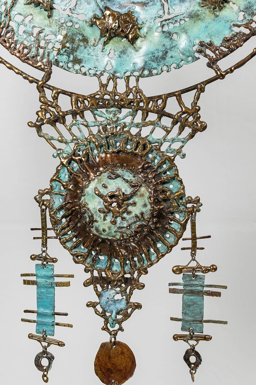 Detail, lower medallion

Openwork lace built by hand. Nothing cast from a mold, nothing repeated.