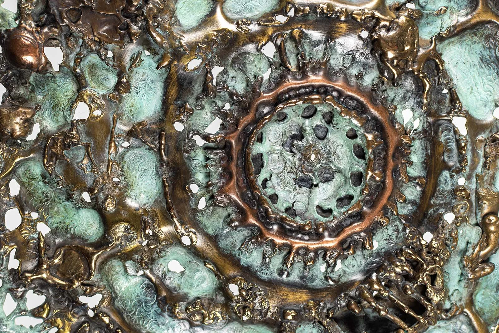 Detail: center-2

The centre worked outward from a single spiral, bronze drawn in flame over turquoise patina.