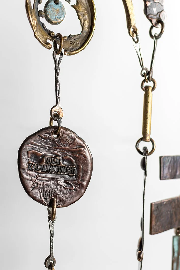 The artist's thumbprint pressed into bronze, beside the name, the year, and the mark 1 of 1.