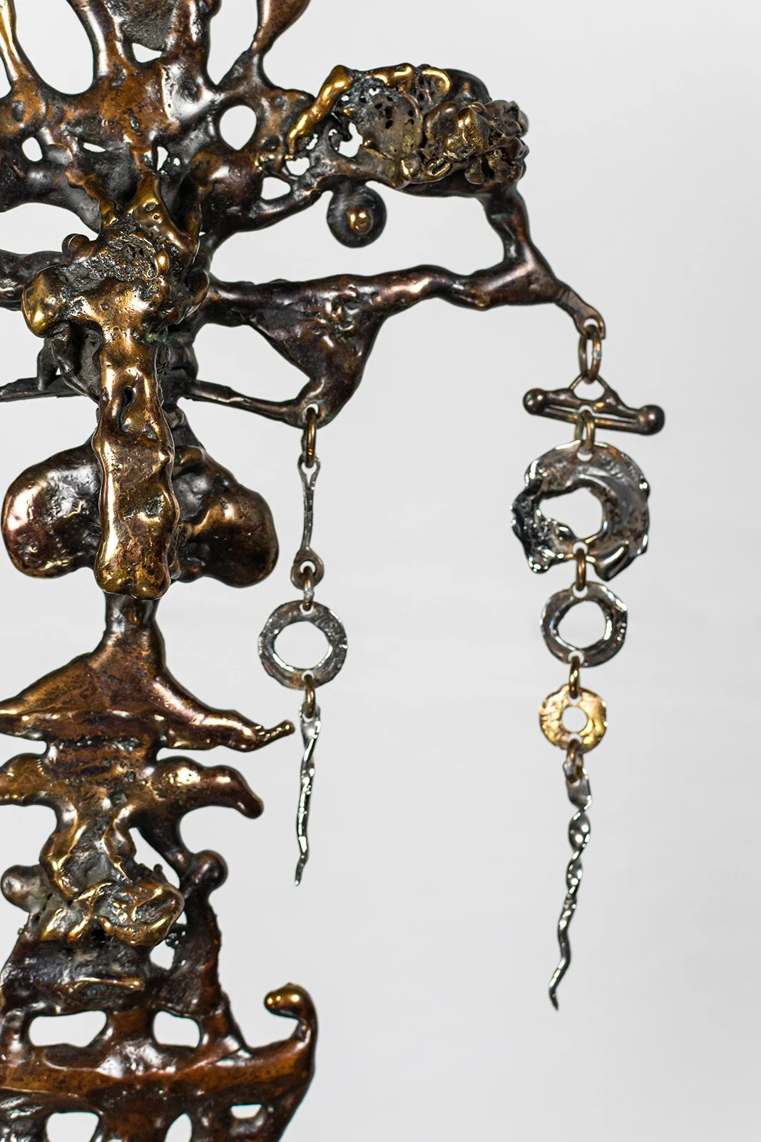 Molten bronze poured directly into sand. No mould, no model. The metal decided its own shape in the instant it landed, and was kept exactly as it fell.