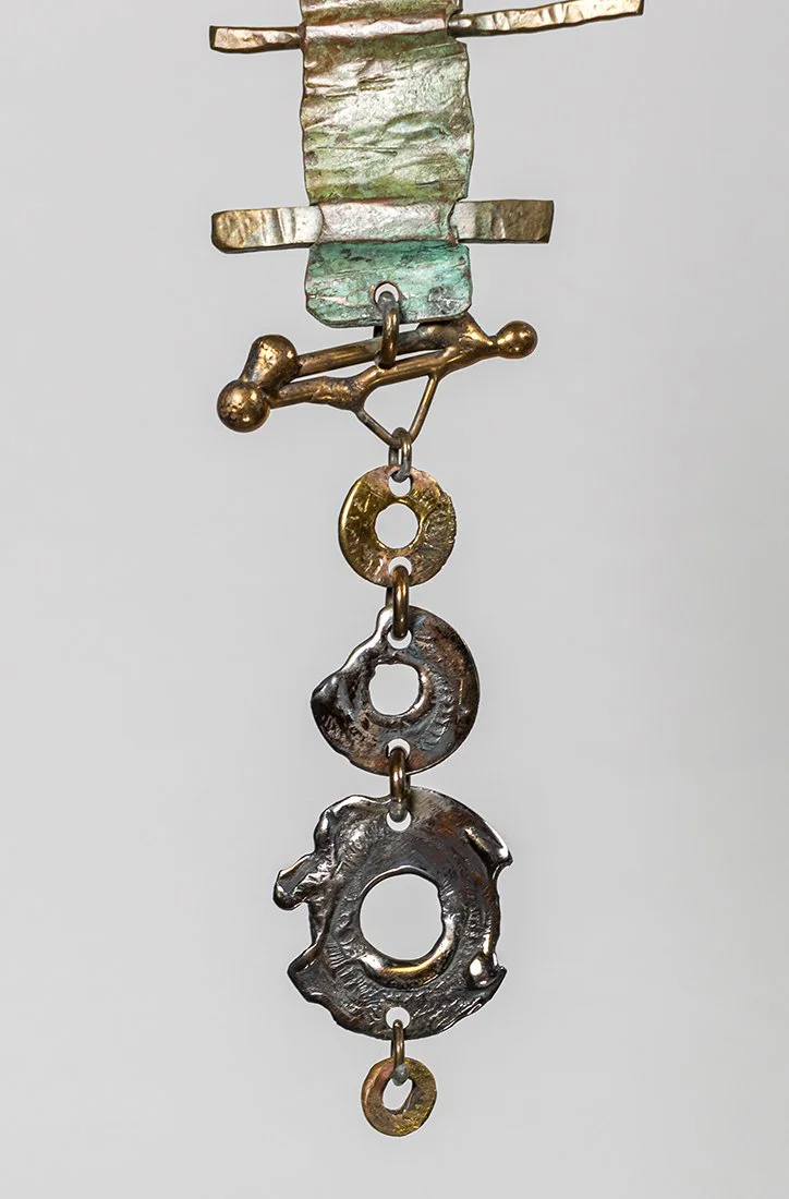 Detail, rim

Every ring and suspended element formed by hand and flame.