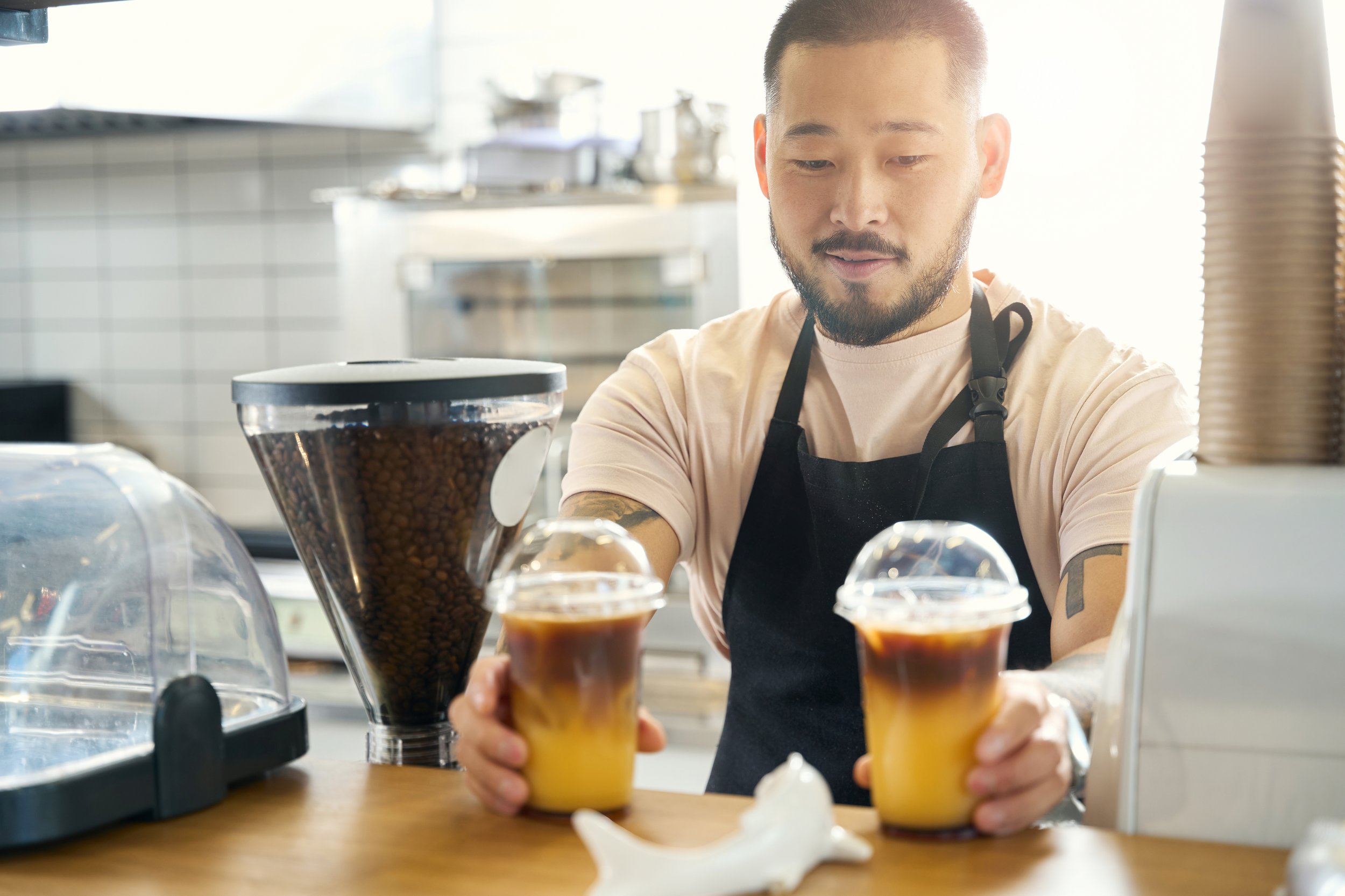 lovely-asian-coffee-shop-worker-presenting-two-fre-2026-01-05-22-39-23-utc.jpg