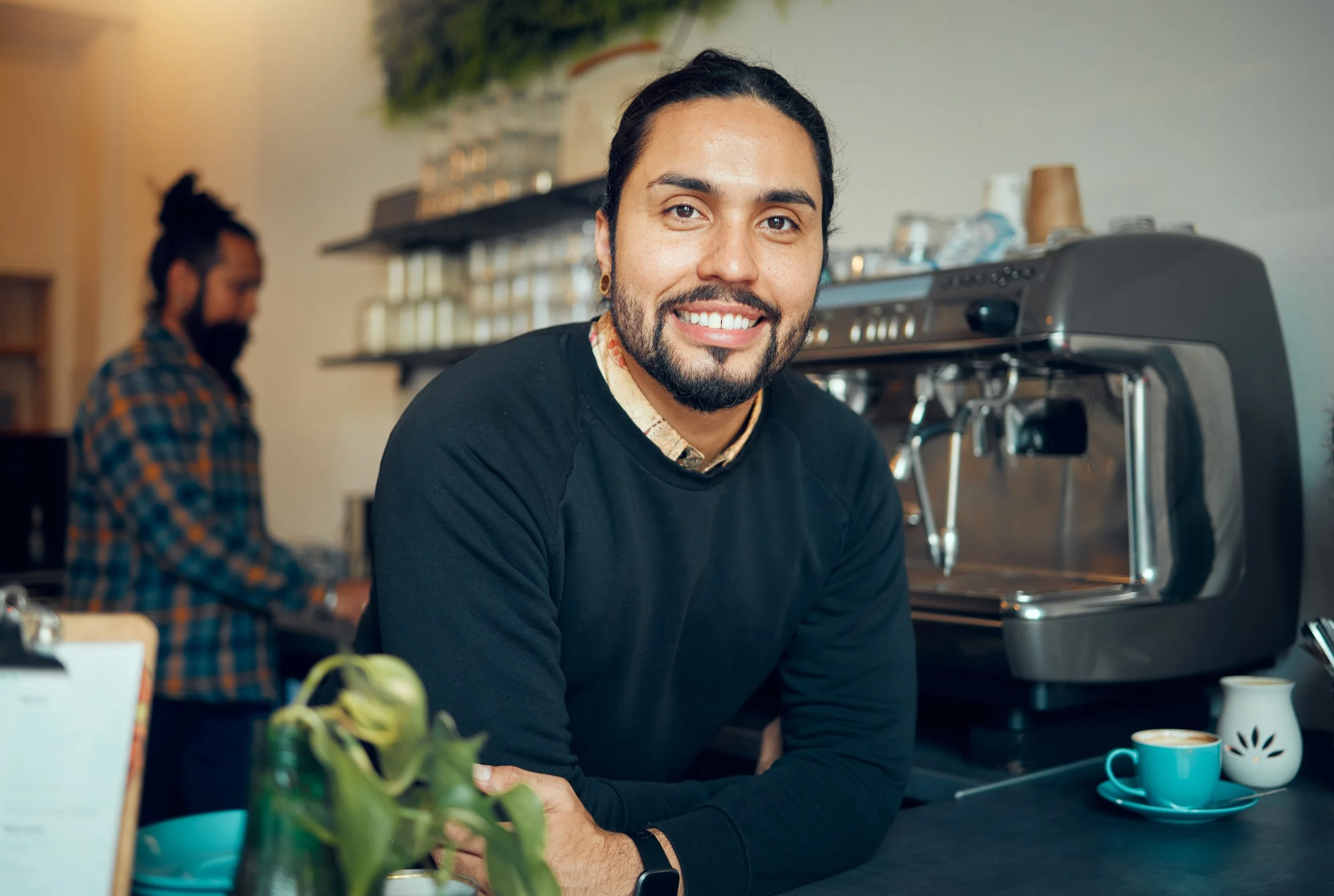 portrait-coffee-shop-and-barista-with-a-man-at-wo-2026-01-09-11-41-23-utc.jpg
