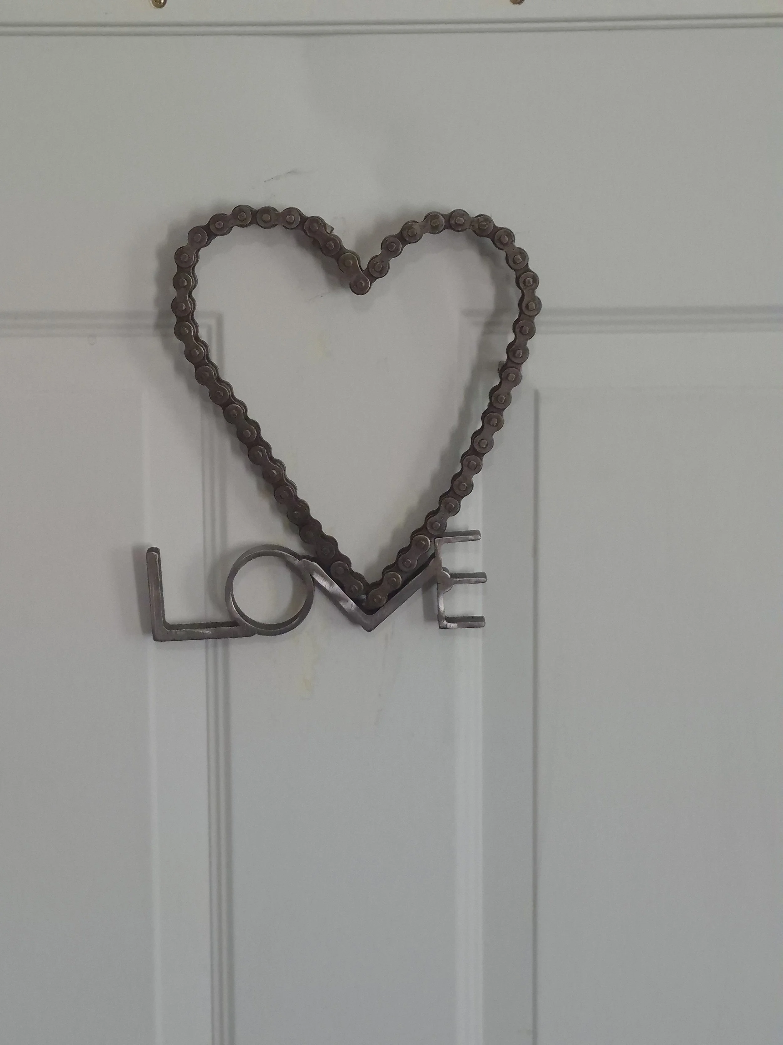 Chain love wall art - handcrafted from repurposed chain and metal materials, this rustic heart design symbolizes love, strength, and creativity. A unique statement piece perfect for your home or to gift. | Price: $25 | Quantity in stock: 1