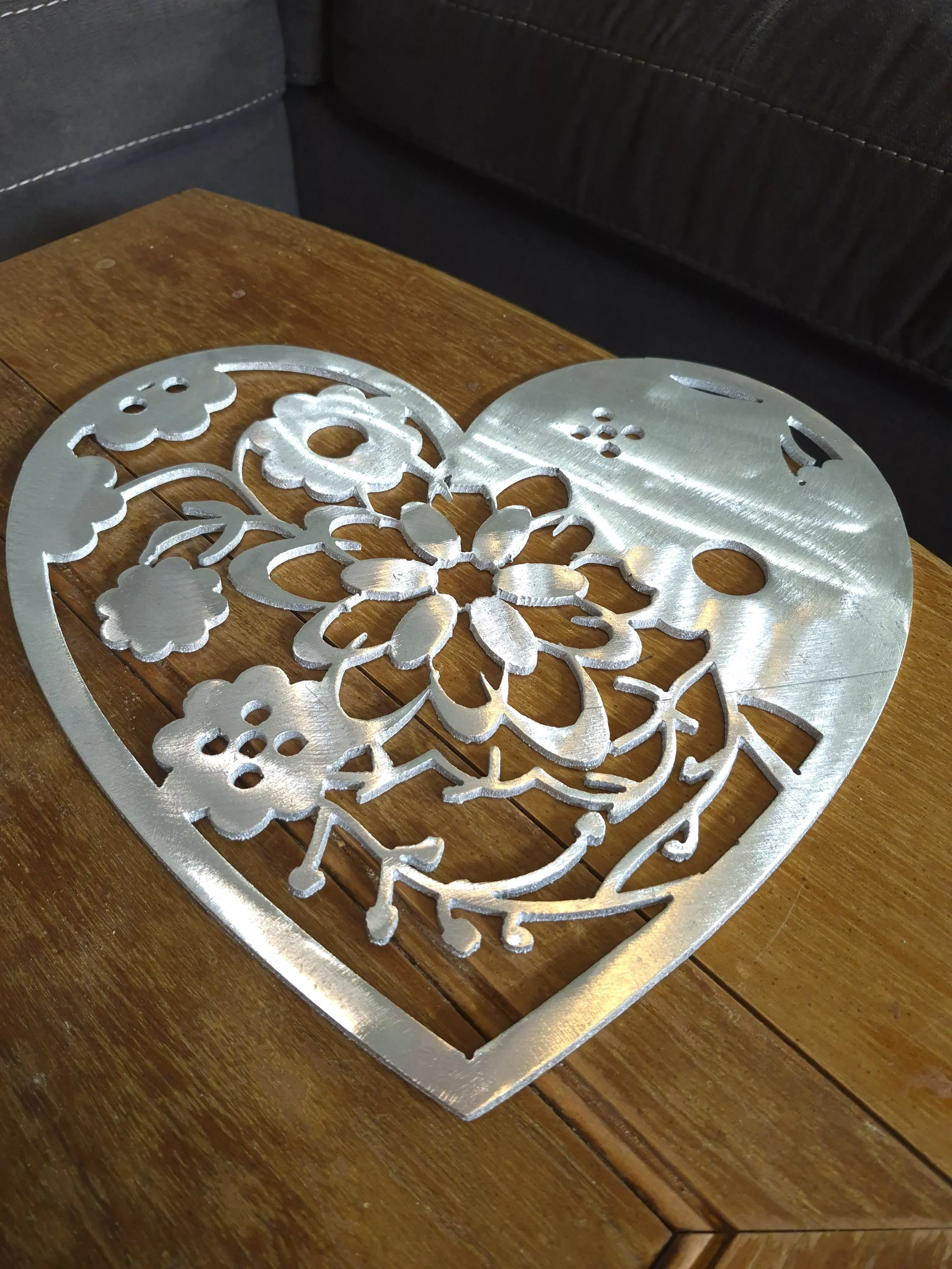 This beautiful handcrafted aluminum floral heart metal cutout features intricate detailing and timeless design is perfect for wall decor, gifts, or anyone looking to add a little charm with a meaningful handmade piece. | Price: $50 | Quantity in stoc