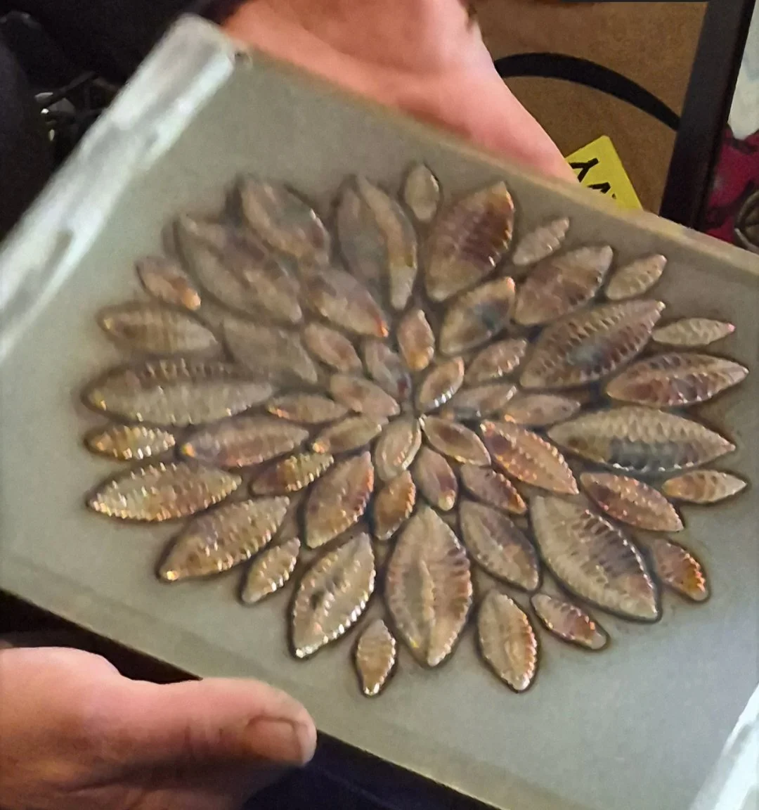 Handcrafted statement wall art featuring individually welded textured metal petals arranged in a stunning floral design. This one-of-a-kind piece blends elegant detail with industrial craftsmanship making it a standout addition to any home. | Price: 