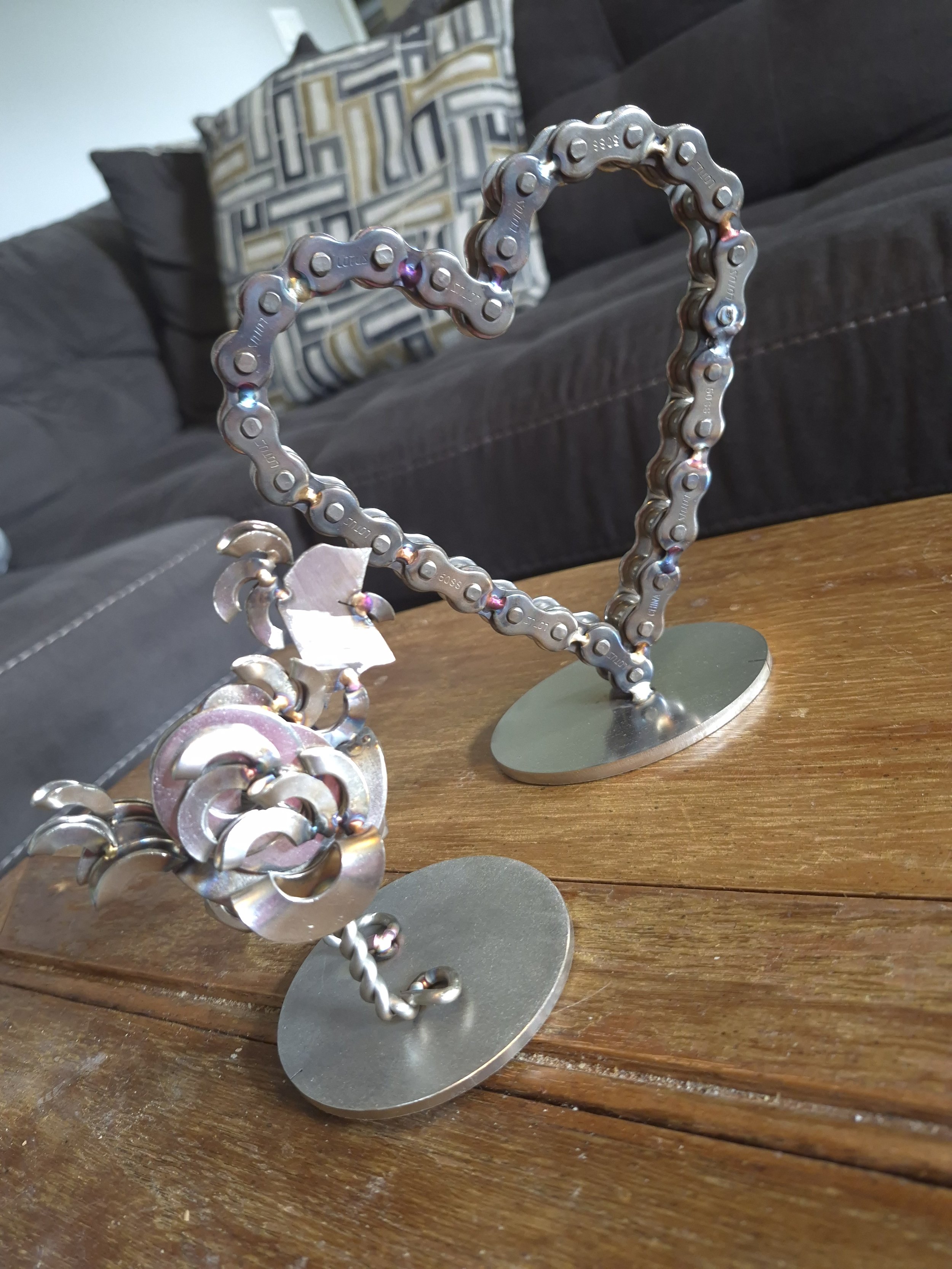 Chain Heart - Crafted from stainless steel chain and metal materials, this handmade heart symbolizes strength and love with an industrial twist. Perfect for home decor, or gift giving.

| Price: $50 |
Quantity in stock: 1

Scrap chicken - built from 