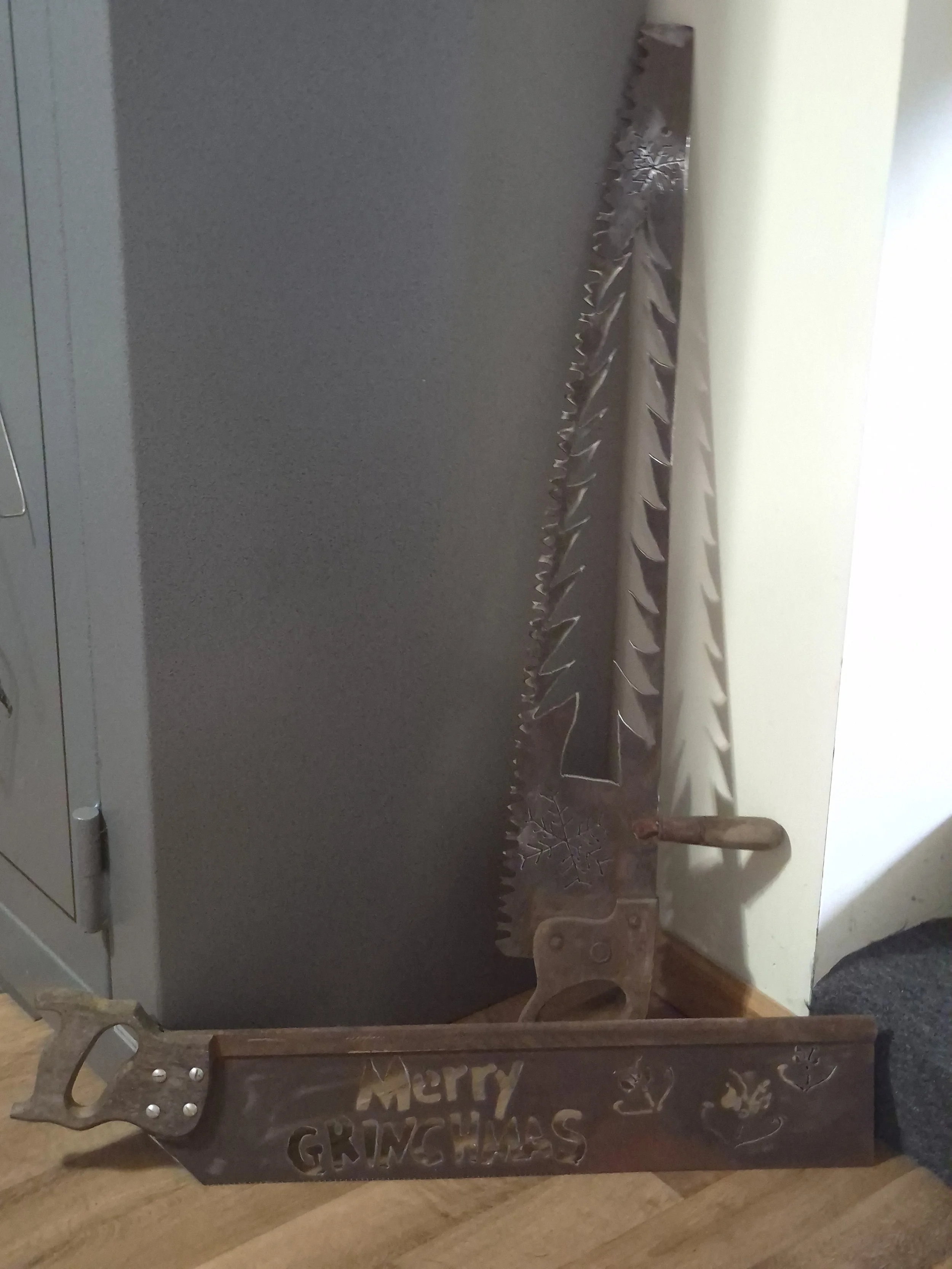 Vintage hand saw with rustic character and timeless craftsmanship. Great for unique winter decor. This handcrafted pine tree cut out or the 'Merry Grinchmas' piece adds playful holiday personality to your Christmas decor, and makes the perfect gift f