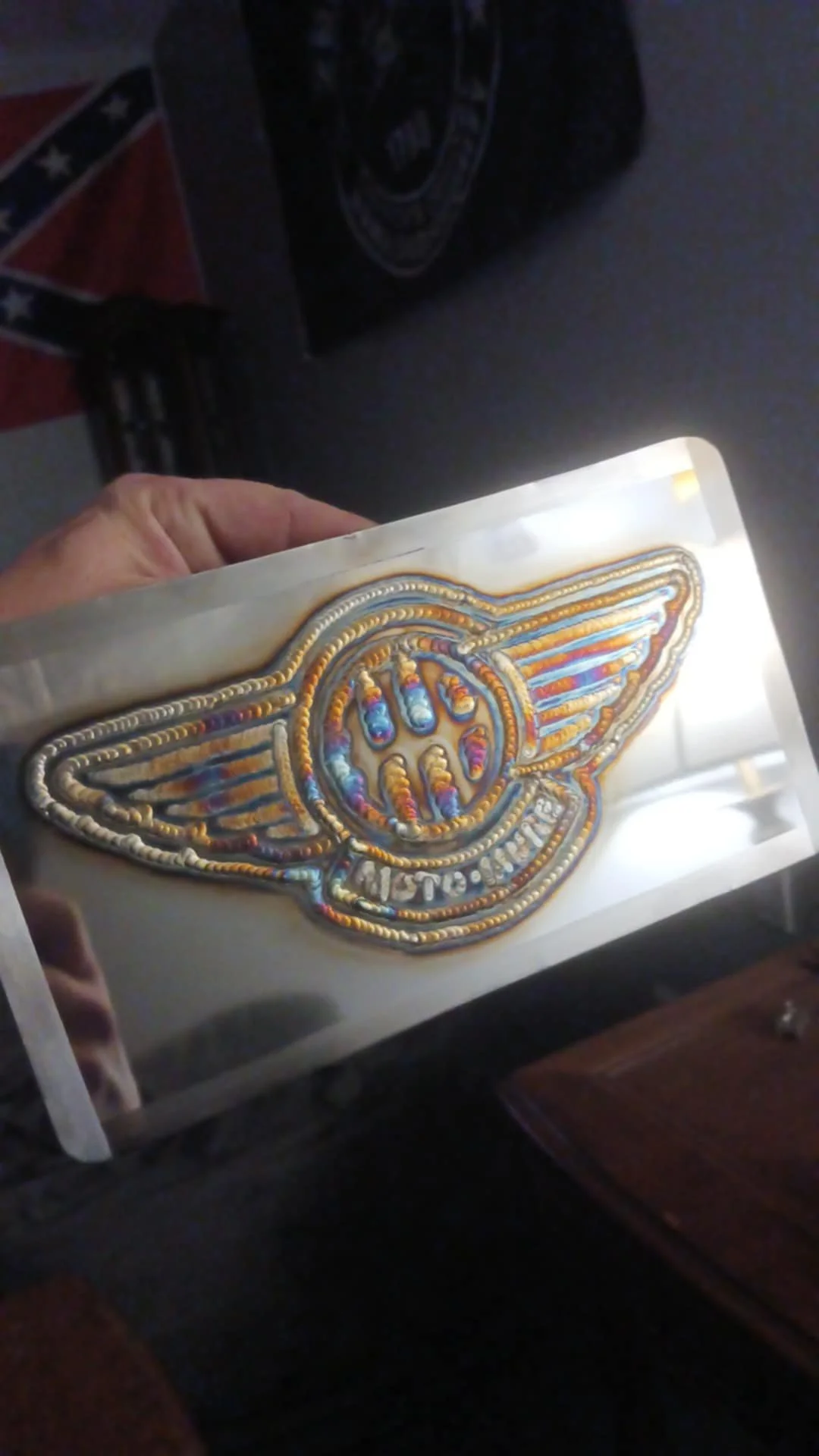 Handcrafted metal art featuring a bold winged motorcycle design with vibrant heat-treated weld colors. A perfect statement piece for bikers, garage decor, man caves, shops or anyone who loves a handcrafted metal piece of art. | Price: $40 | Quantity 