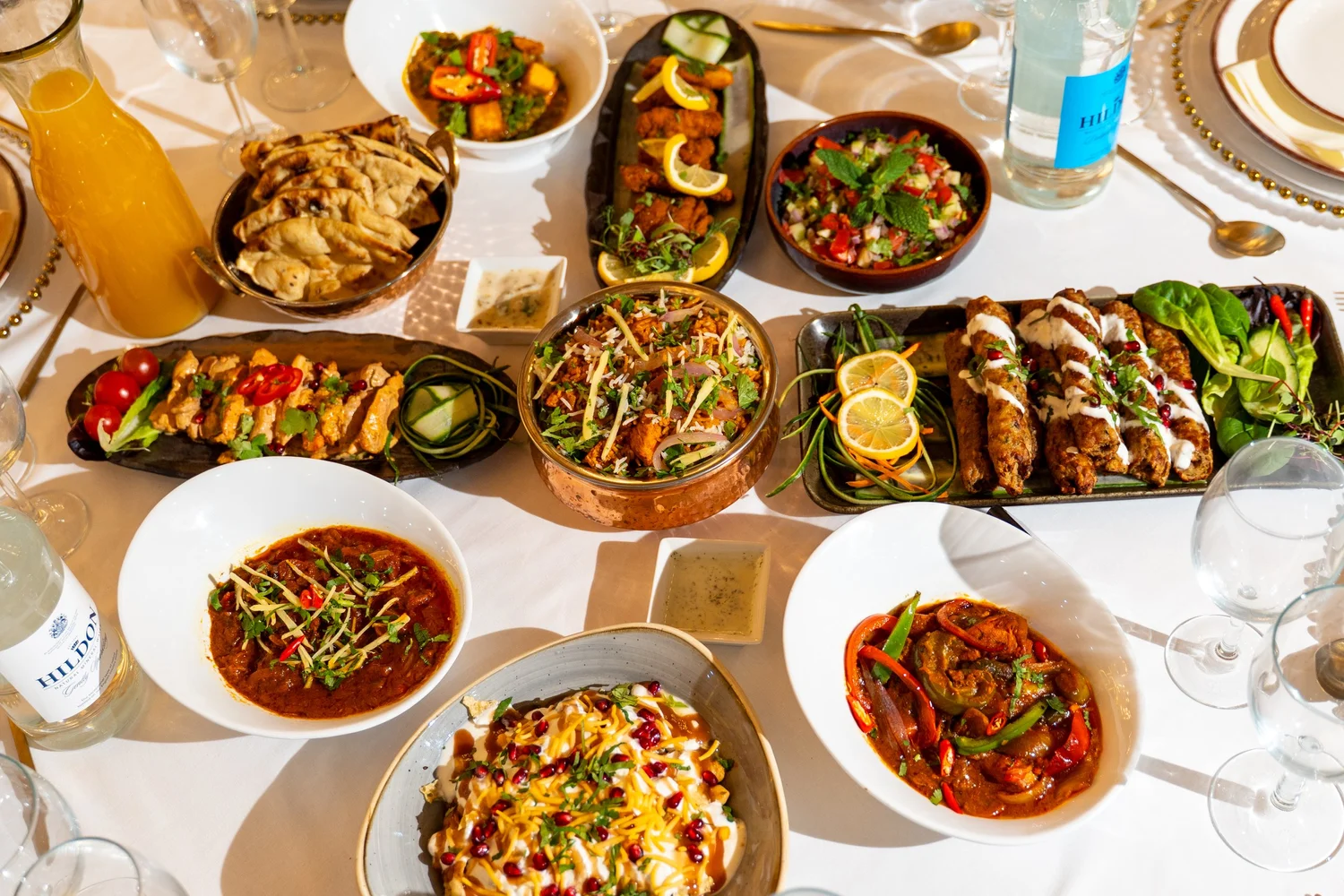 A wedding catering spread with rice, starters and main dishes