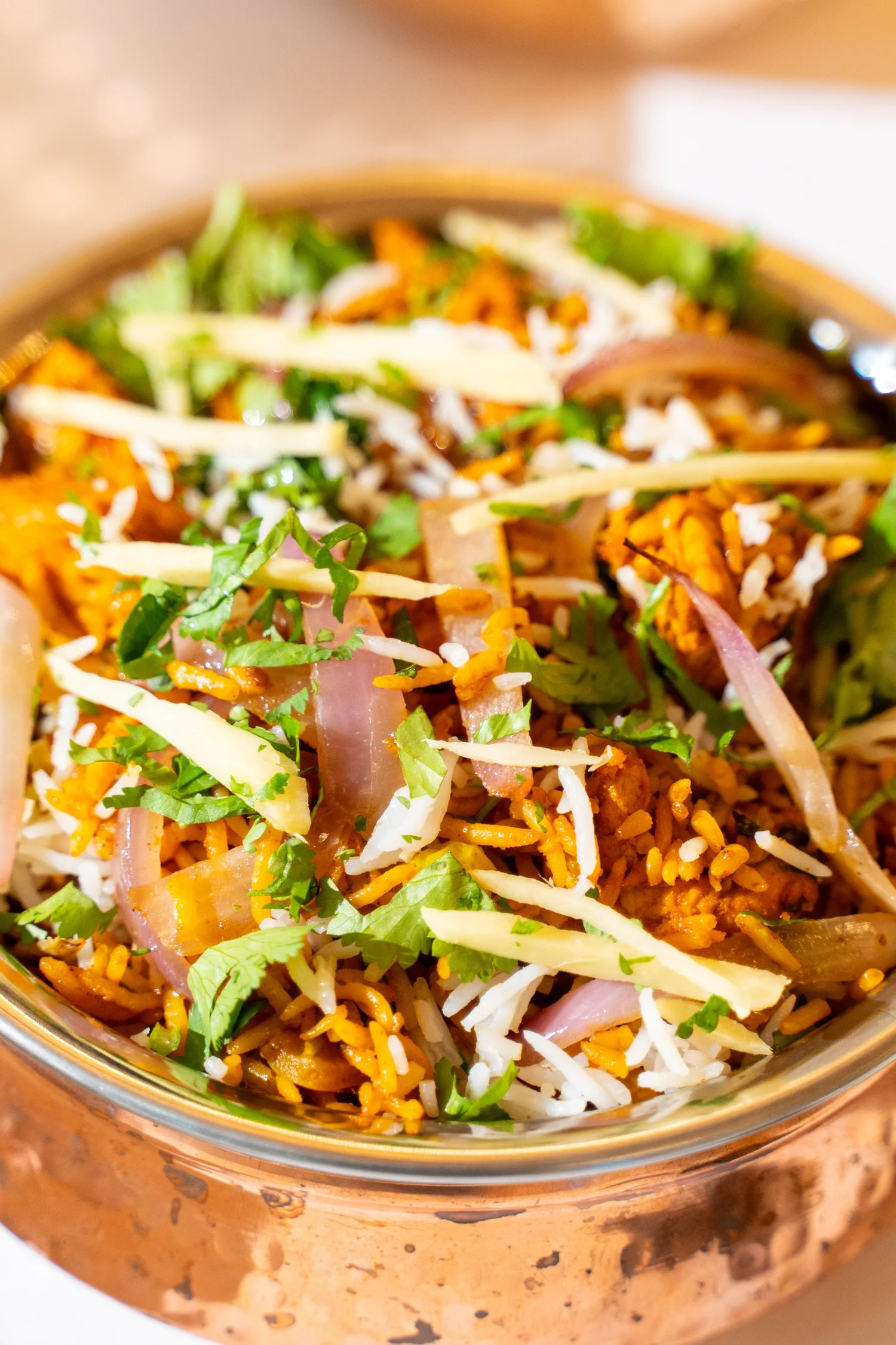 Rice garnished with herbs and sliced vegetables