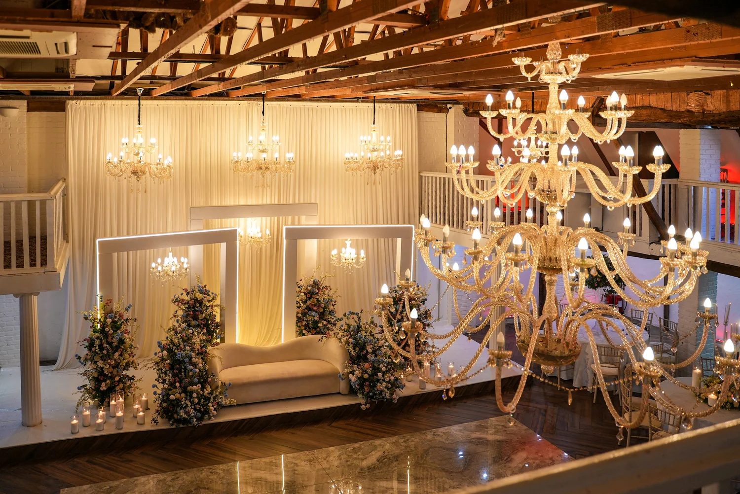 The wedding stage beneath the Grand Hall chandeliers