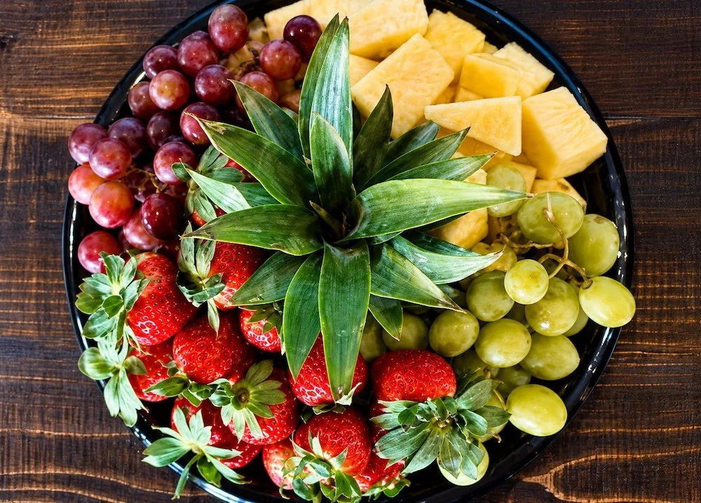 Platter of fresh fruit including berries, grapes, and melon from Sam's in Chestertown