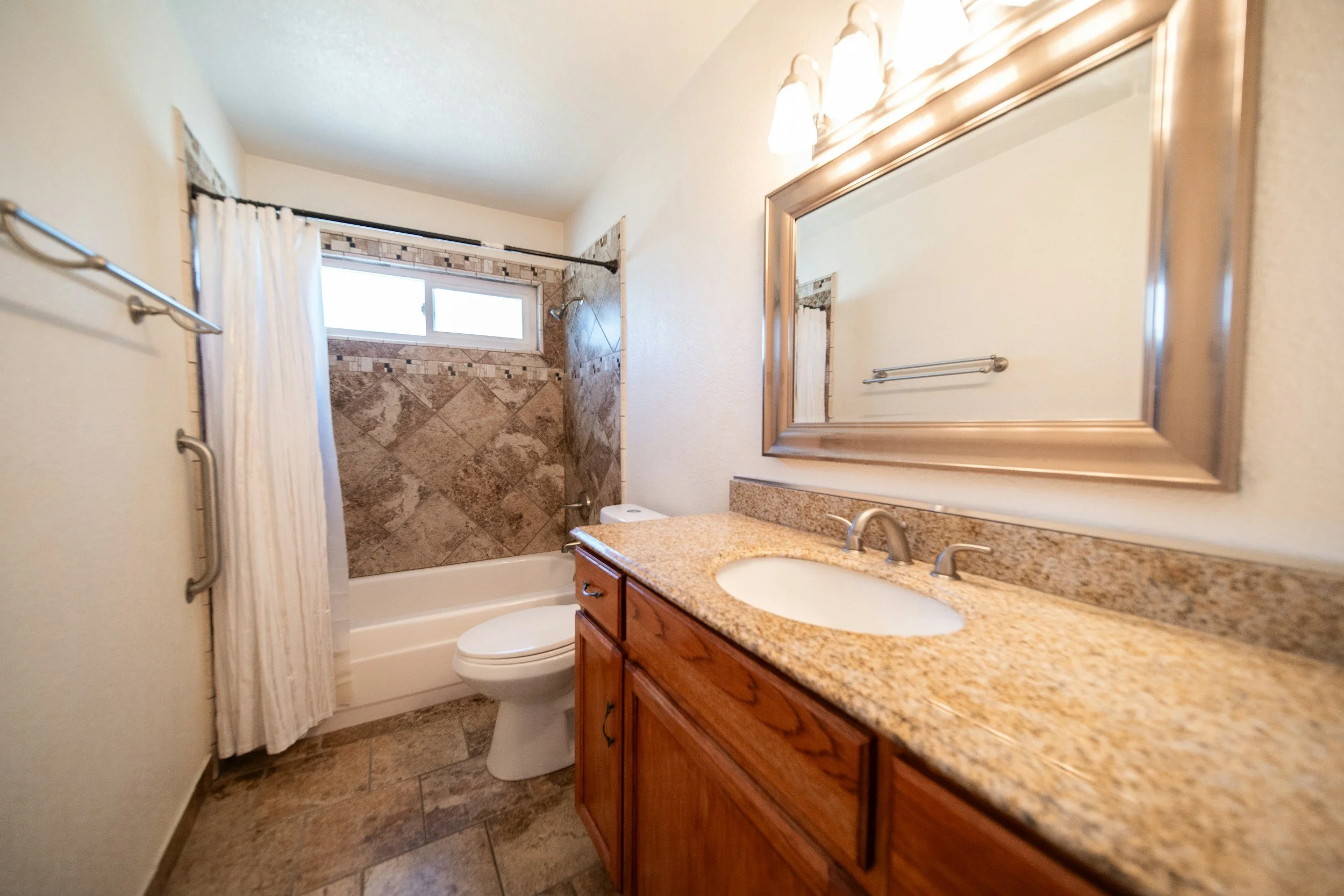 Clean bathroom with polished fixtures and detailed finishing, professionally cleaned home in Pensacola