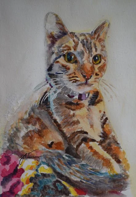 Watercolor painting of a domestic cat with green eyes, sitting with colorful flowers nearby.