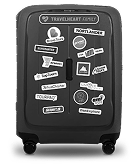 Blackboard with travel-related sketches and words like suitcase, airplane, hotel, and map.