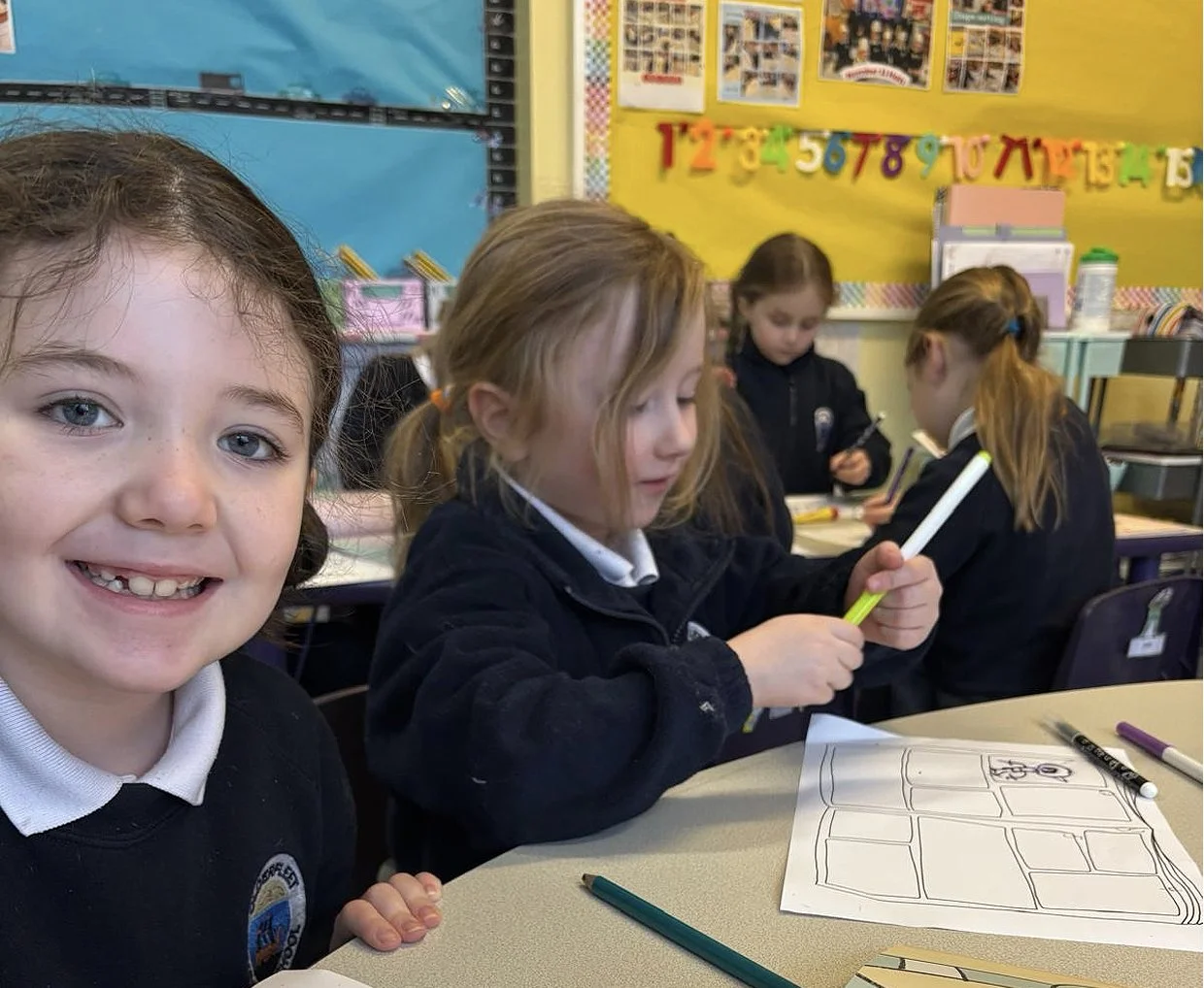 An image of two children learning