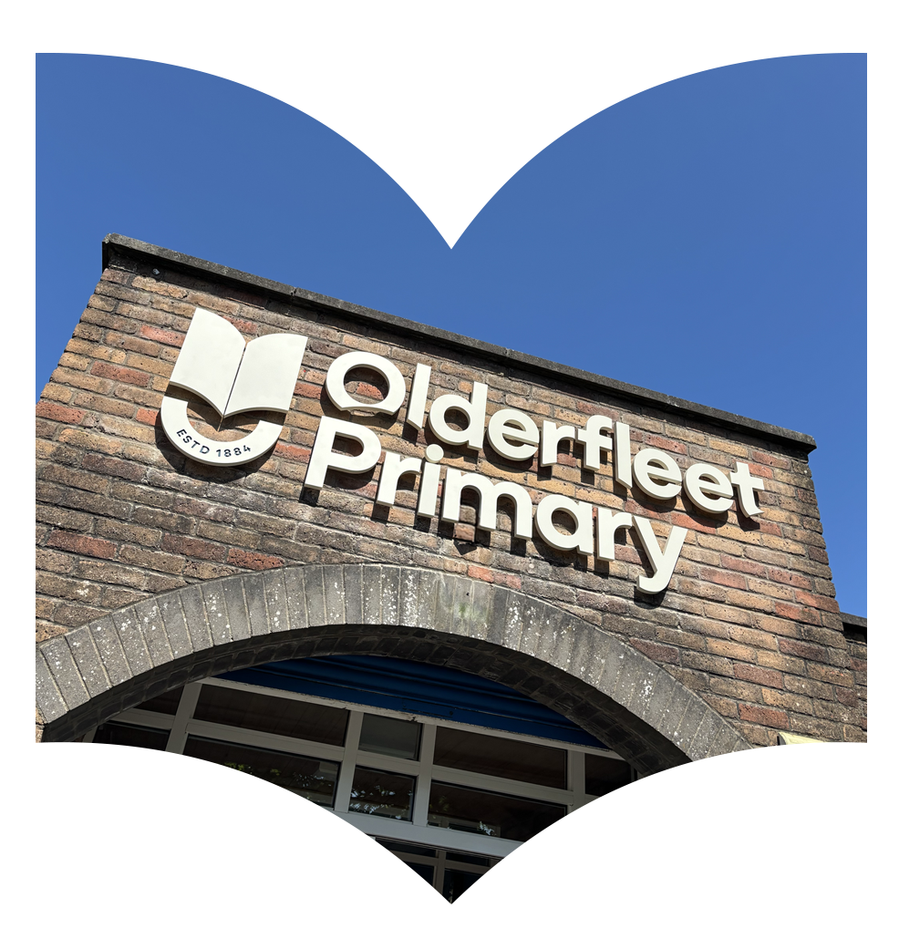 The entrance sign of Olderfleet Primary School on a brick building with a blue sky background.