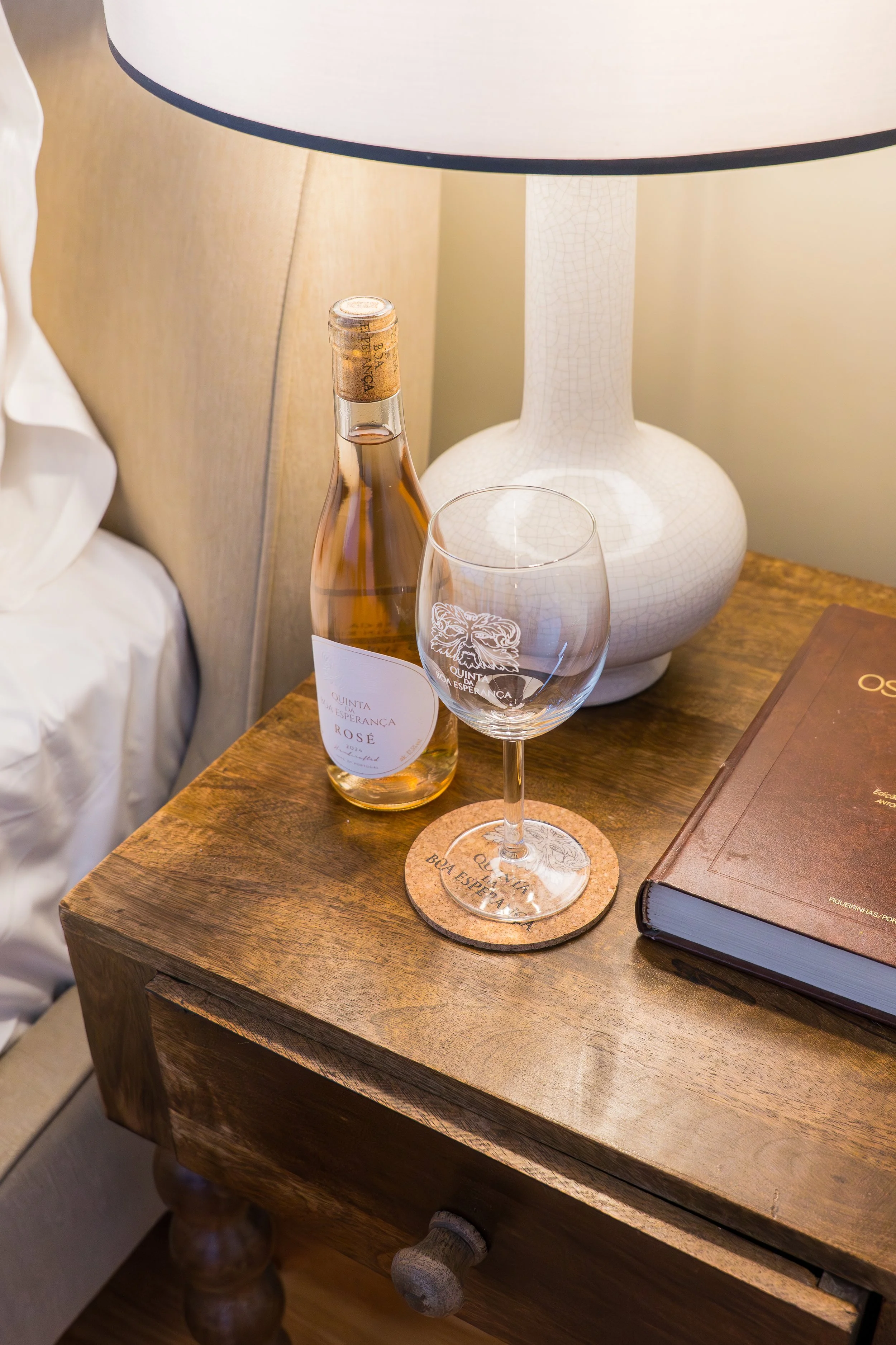 Standard Room Bedside Table With Wine Bottle.jpg