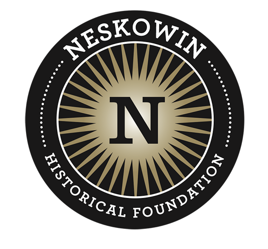 The logo for the Neskowin Historical Foundation features a black circular badge with a central beige starburst and a large black letter N in the middle, with the organization name written around the circle in white.