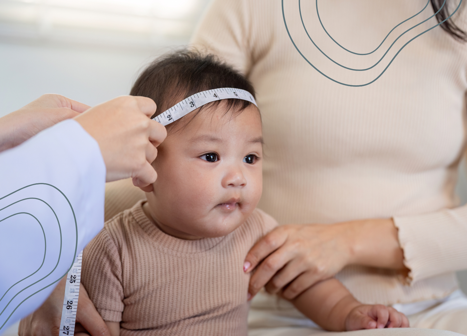 An infant is being measured by a physiotherapist with a measuring tape placed around the child's head.