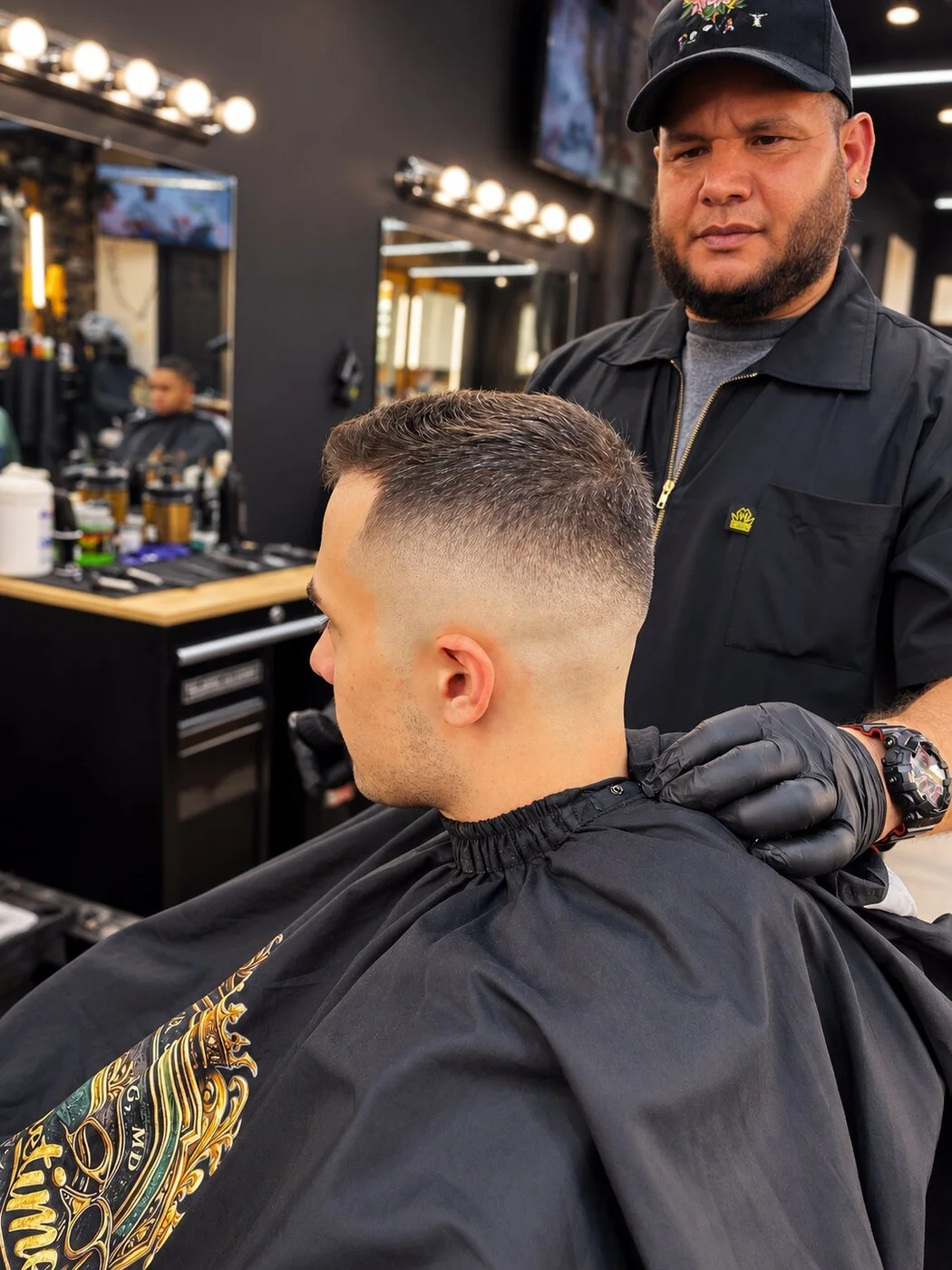 Barber presenting a clean skin fade at Prime Time Barber Lounge in Silver Spring, Maryland.