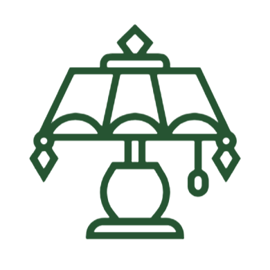 Outline drawing of a table lamp with a decorative shade.