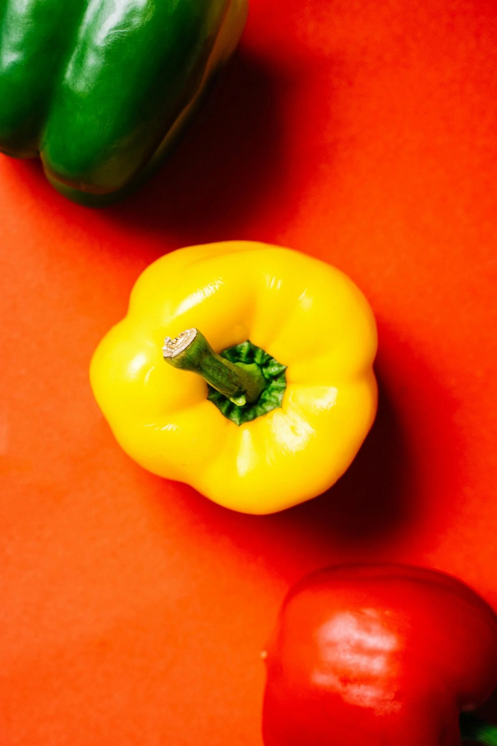 paprika in red, orange and green as a synonym for an ecolabel for food