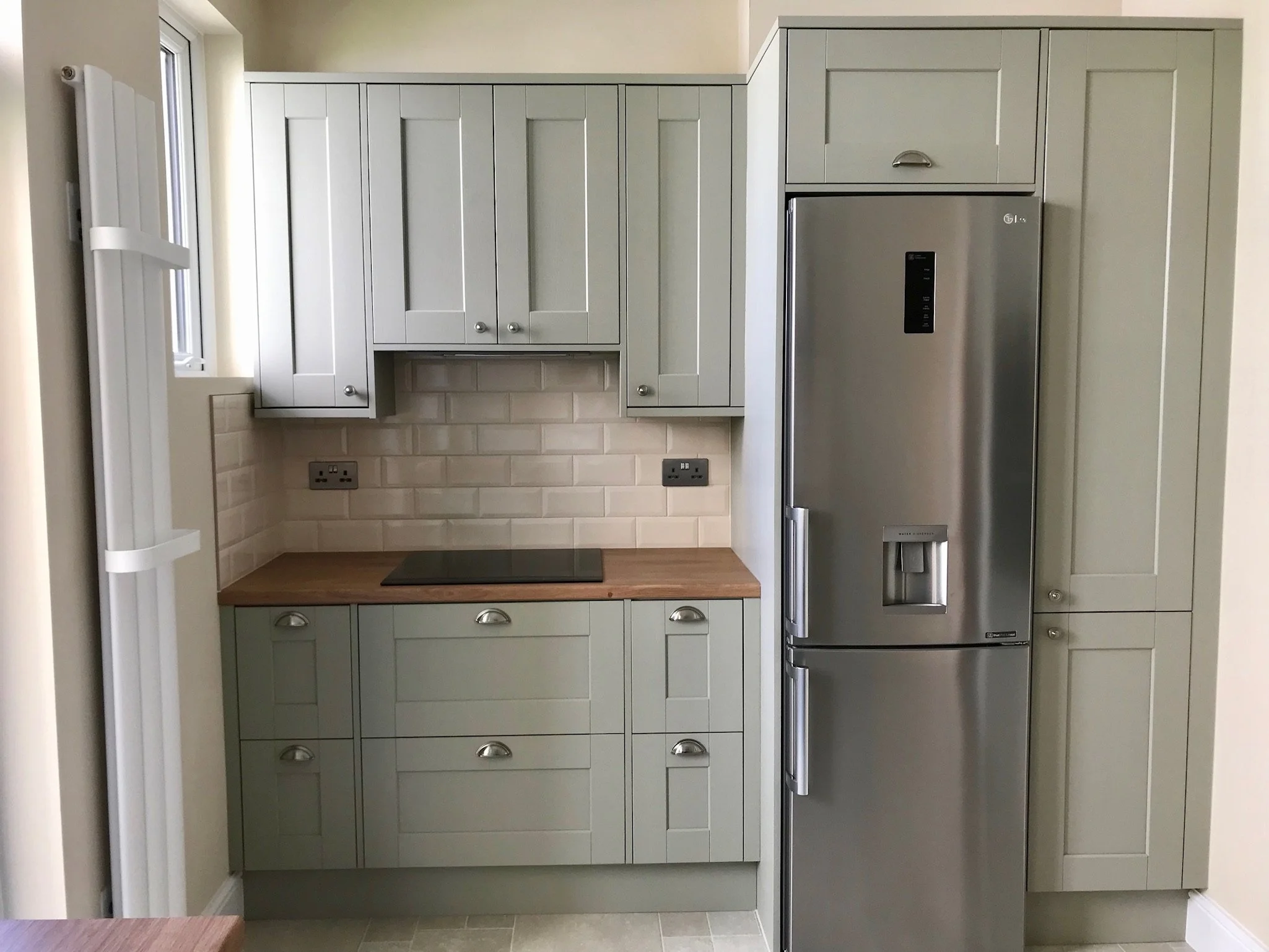 Country green shaker with oak effect laminate worktops