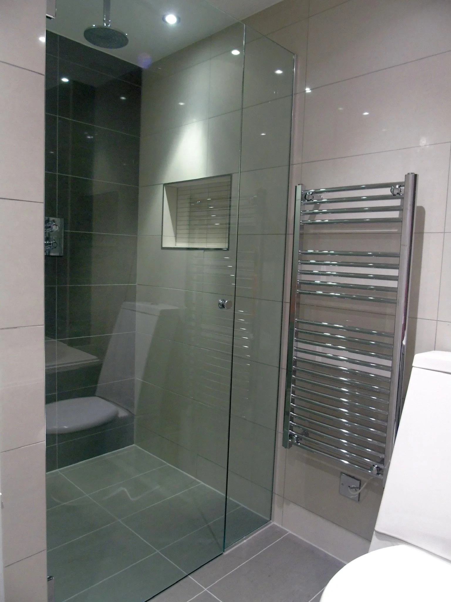 Wet room with double ended bath incl bespoke frameless shower door and screen