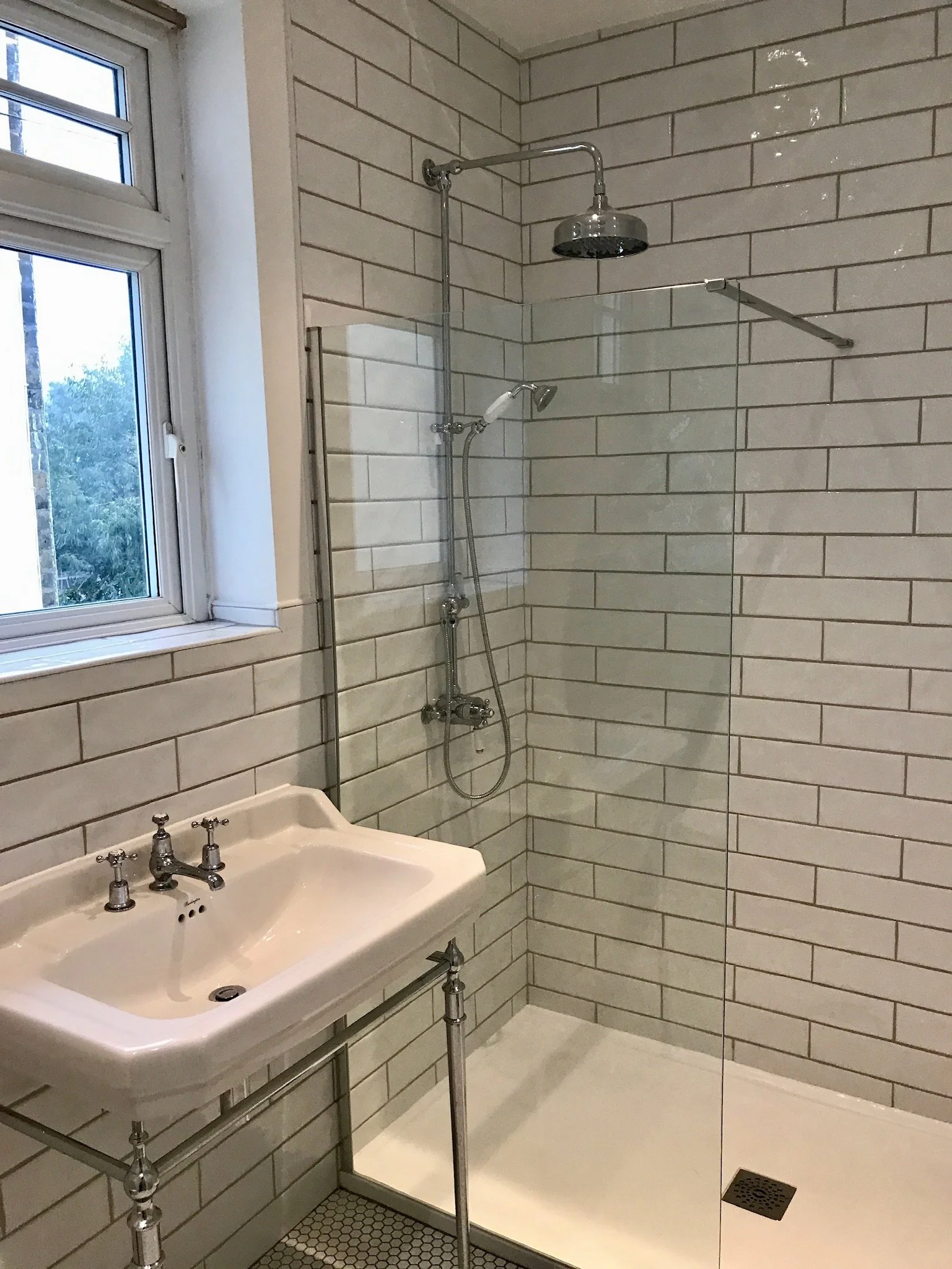 Traditional feel walk in shower with low profile tray