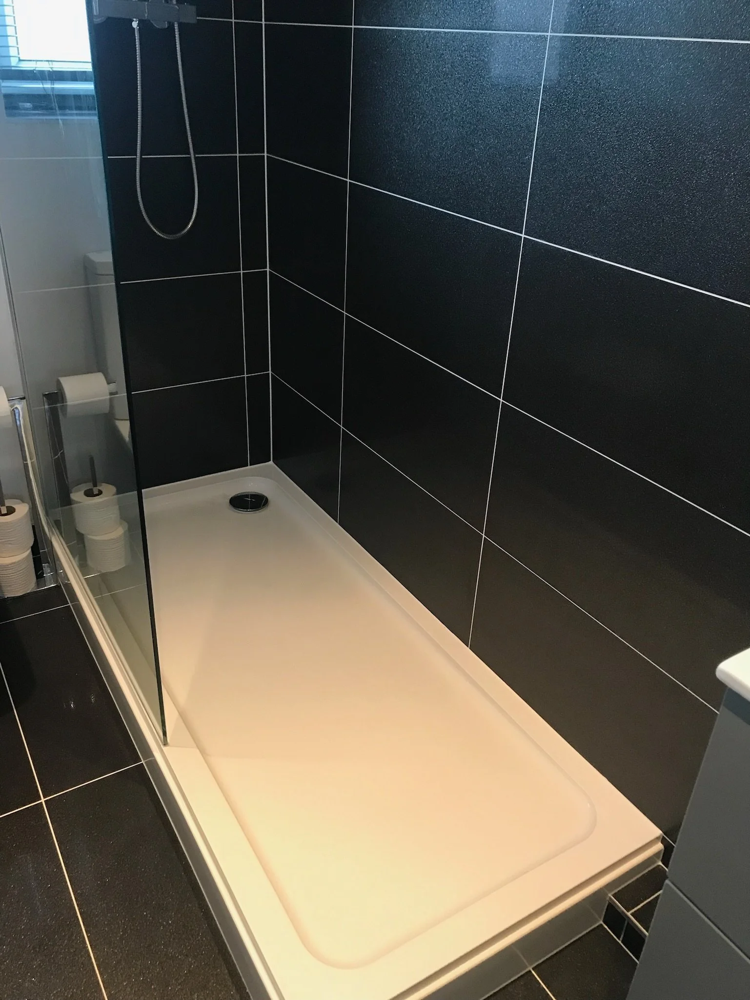 Walk in shower with low profile tray