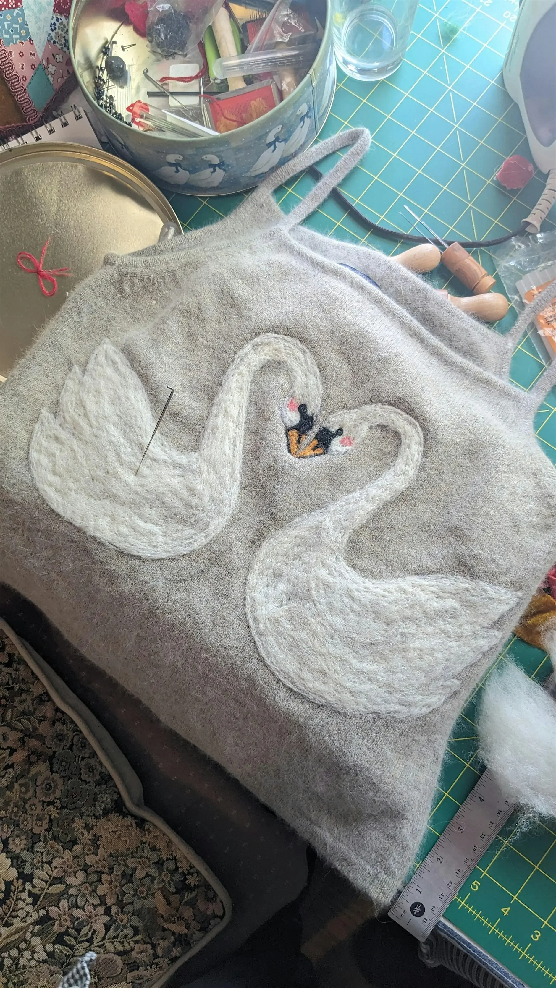 mending and decorating upcycled wool garments
