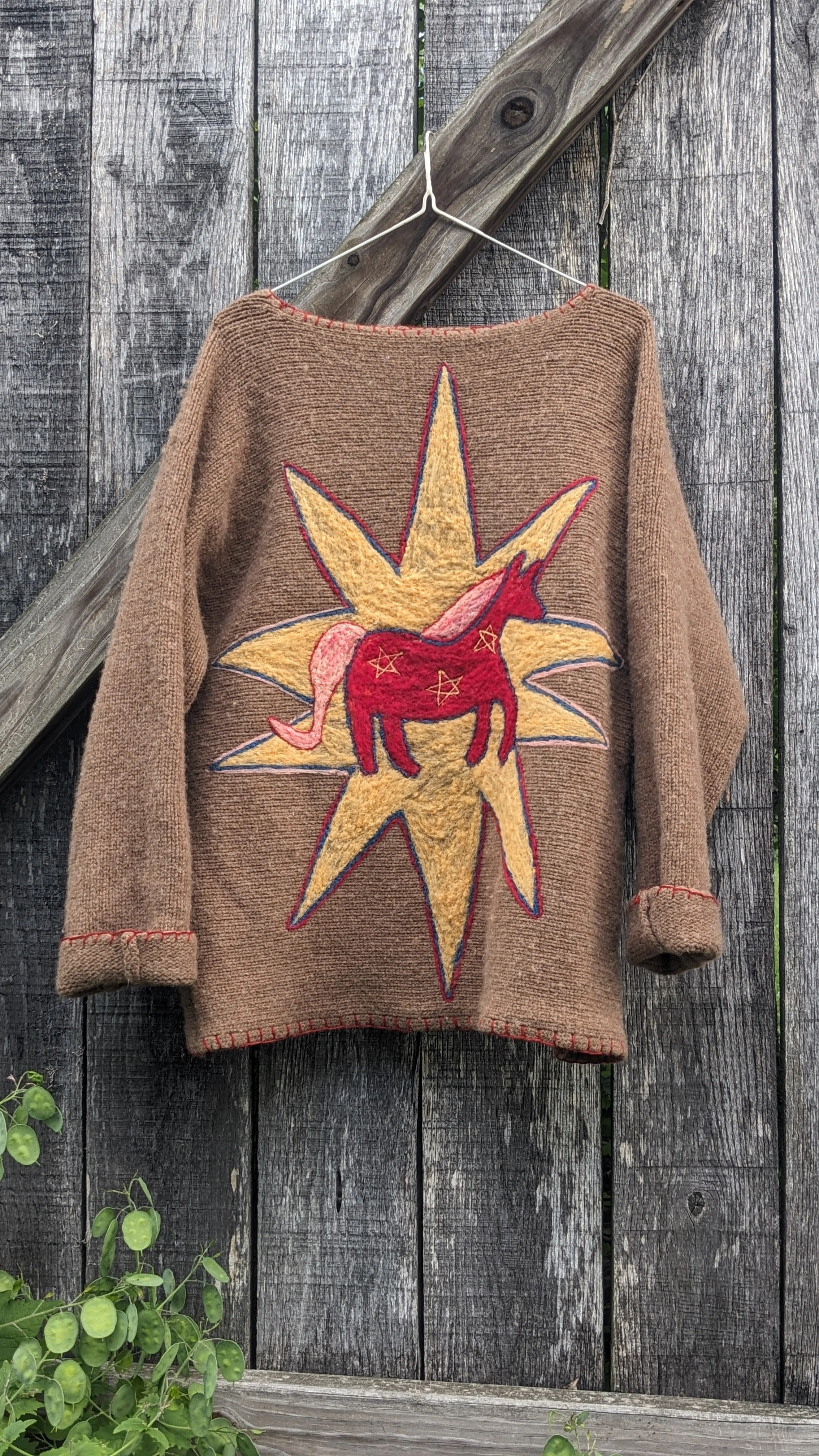 mending and decorating upcycled wool garments