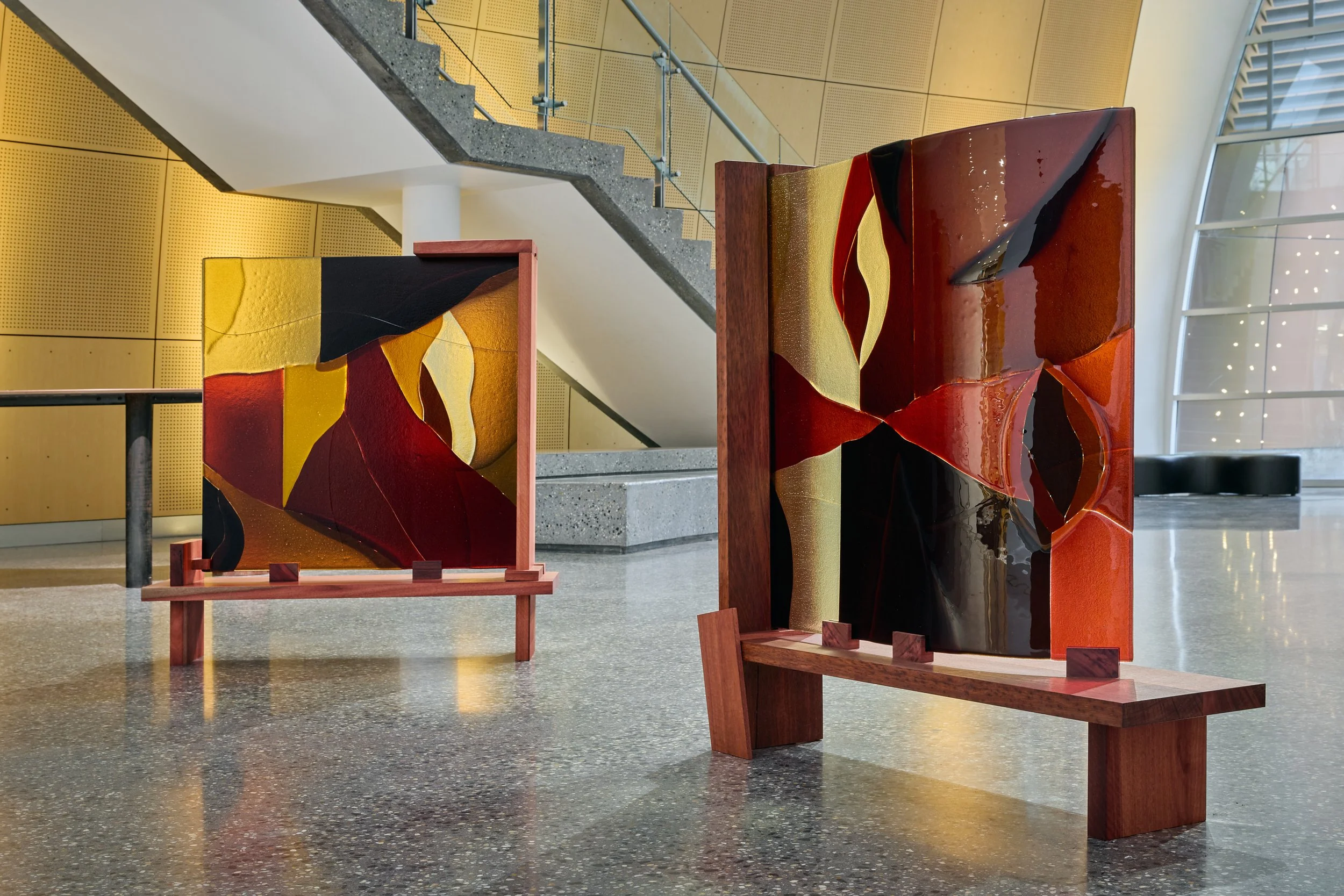 Minor truths IV & V, 2022, kiln formed glass, jarrah. Photo:  Jeremy Weihrauch