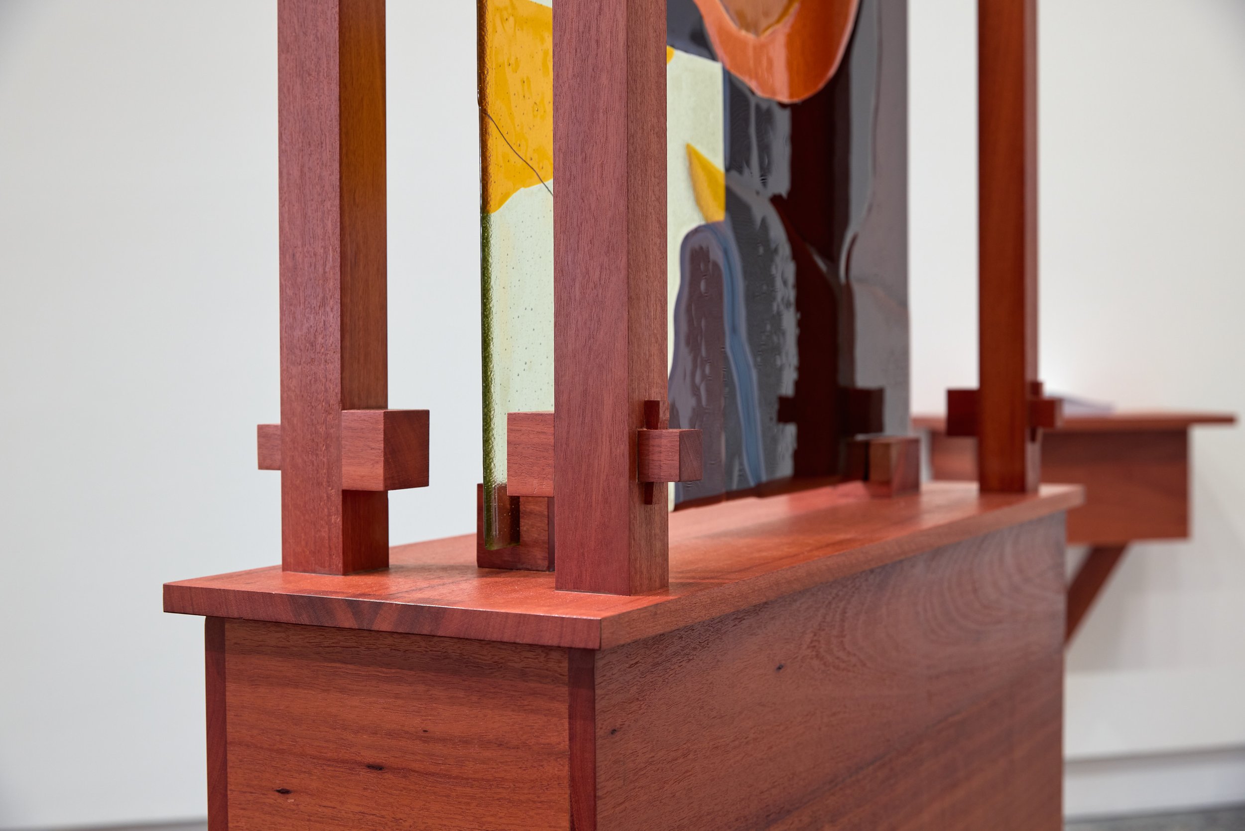 Minor truths III (detail), 2022, kiln formed glass, jarrah. Photo:  Jeremy Weihrauch