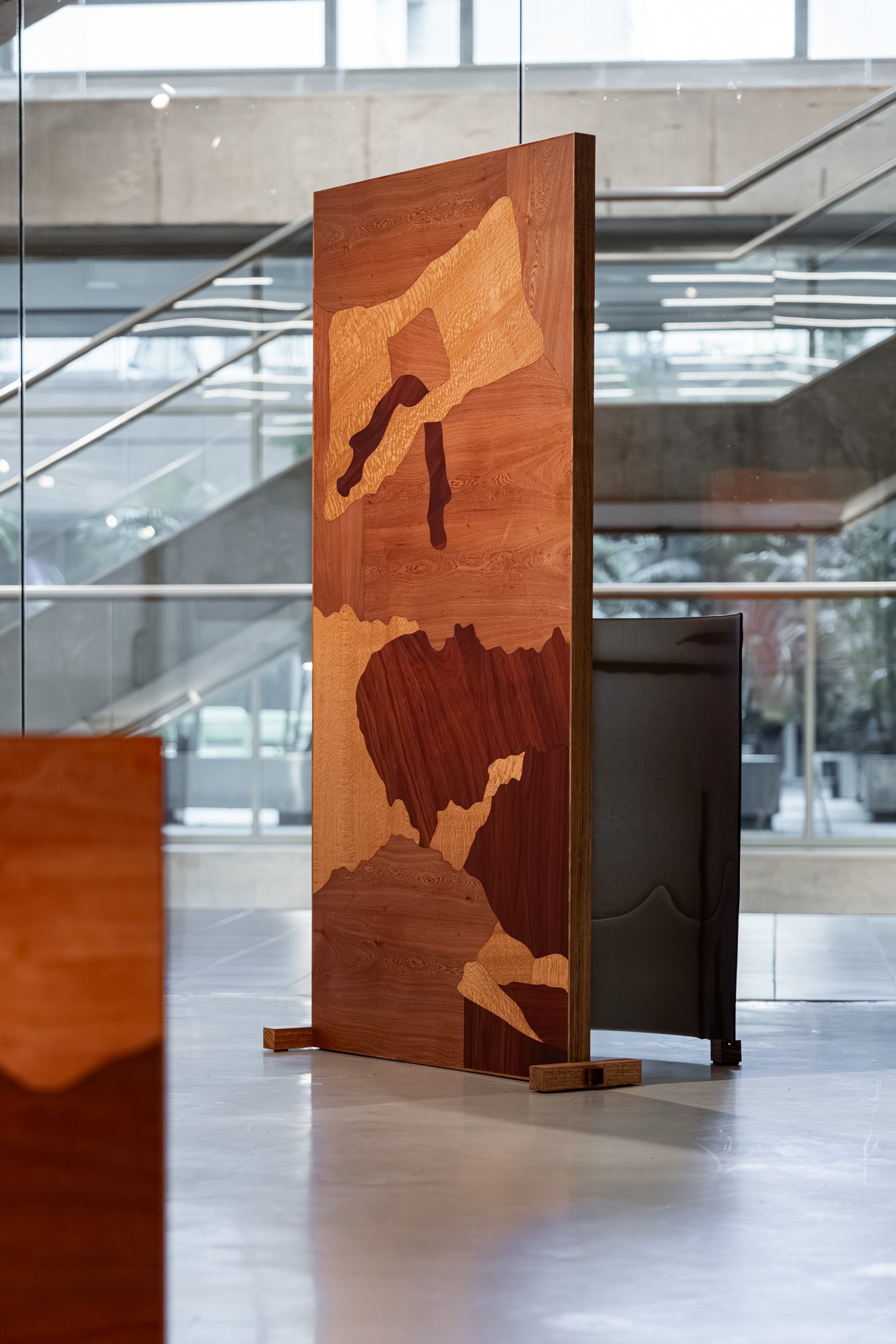 False antithesis III, 2026, kiln-formed glass, timber marquetry (coachwood, silky oak, jarrah), blackwood, felted feral goat fibre, dimensions variable. Photo: Jacquie Manning