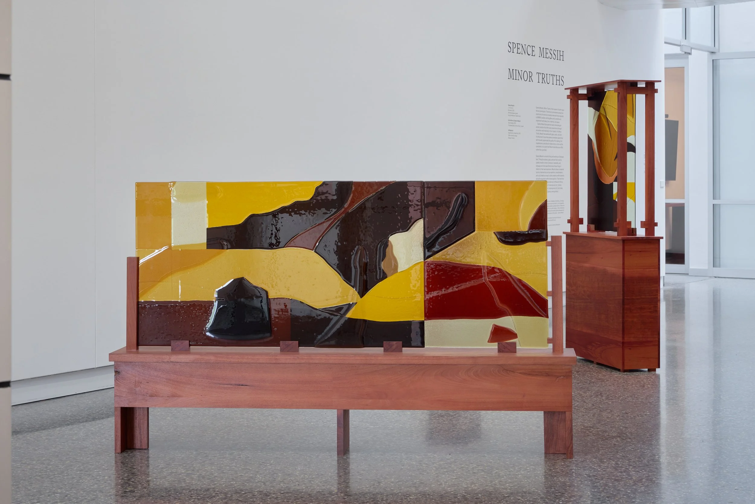 Minor truths II & III, 2022, kiln formed glass, jarrah. Photo:  Jeremy Weihrauch