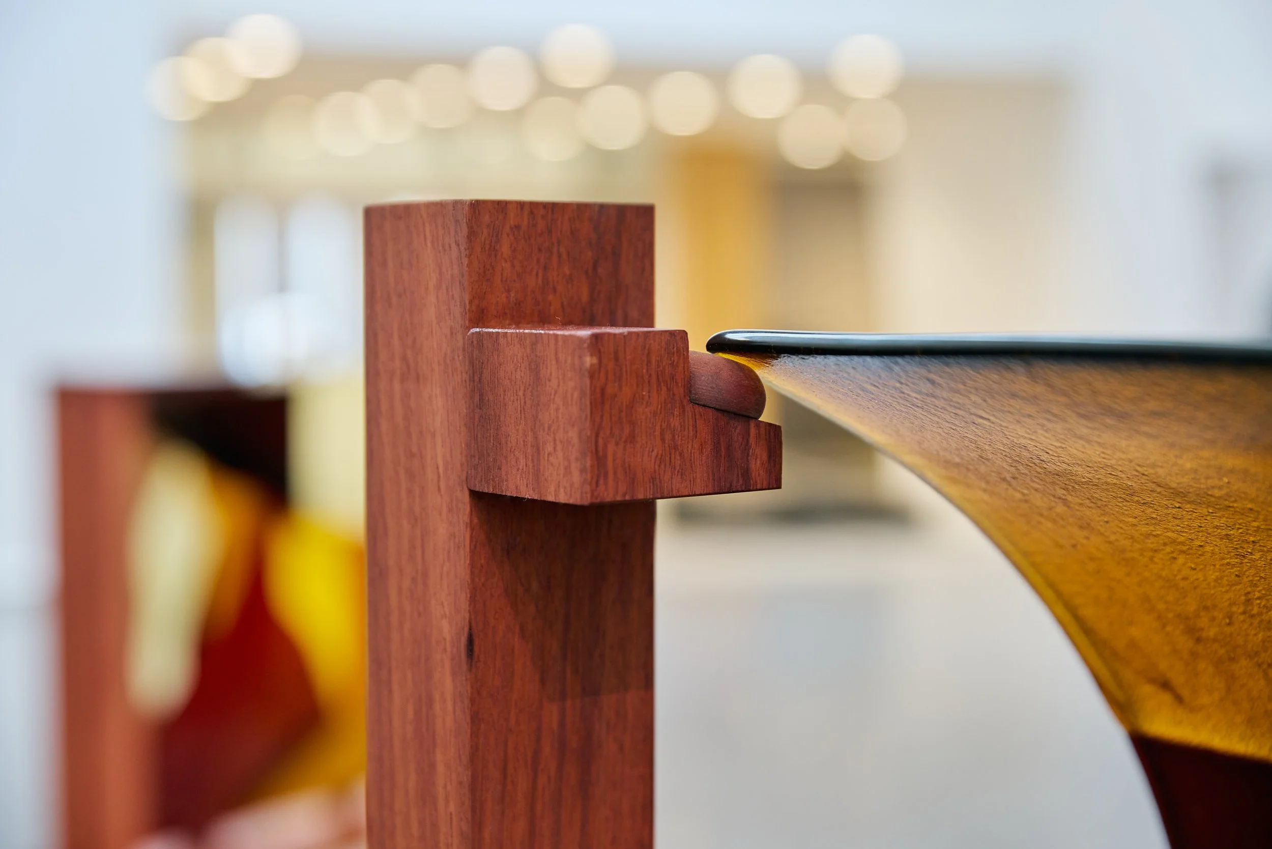 Minor truths I (detail), 2022, kiln formed glass, jarrah. Photo:  Jeremy Weihrauch