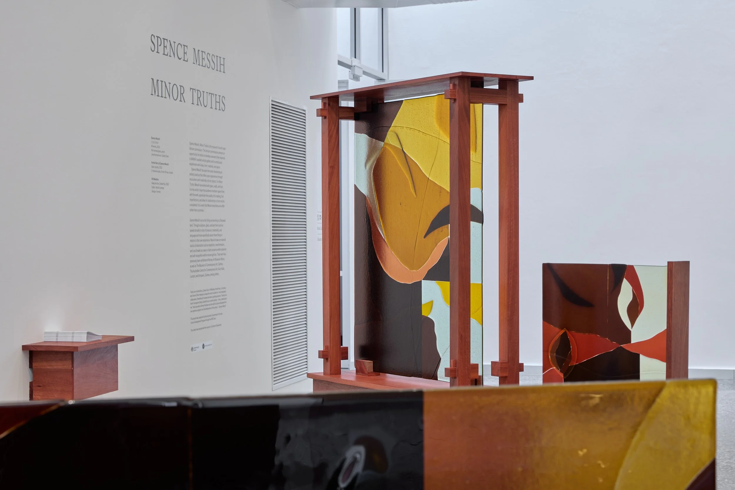 Minor truths III & V, 2022, kiln formed glass, jarrah. Photo:  Jeremy Weihrauch