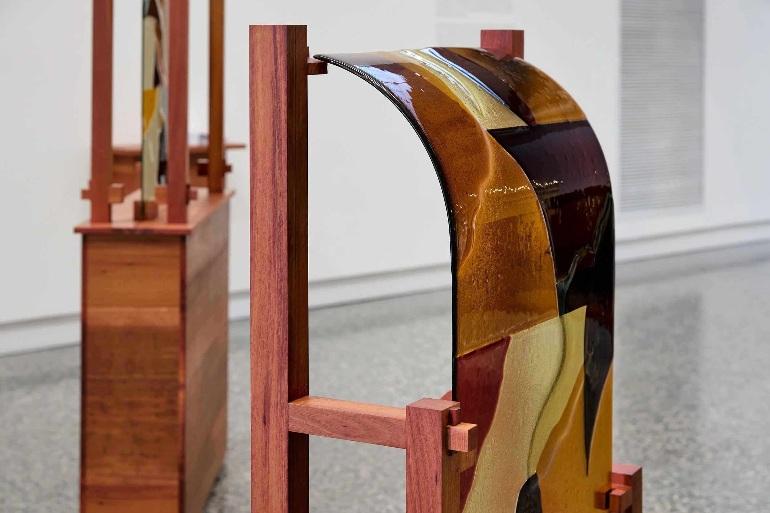 Minor truths III & I (detail), 2022, kiln formed glass, jarrah. Photo:  Jeremy Weihrauch