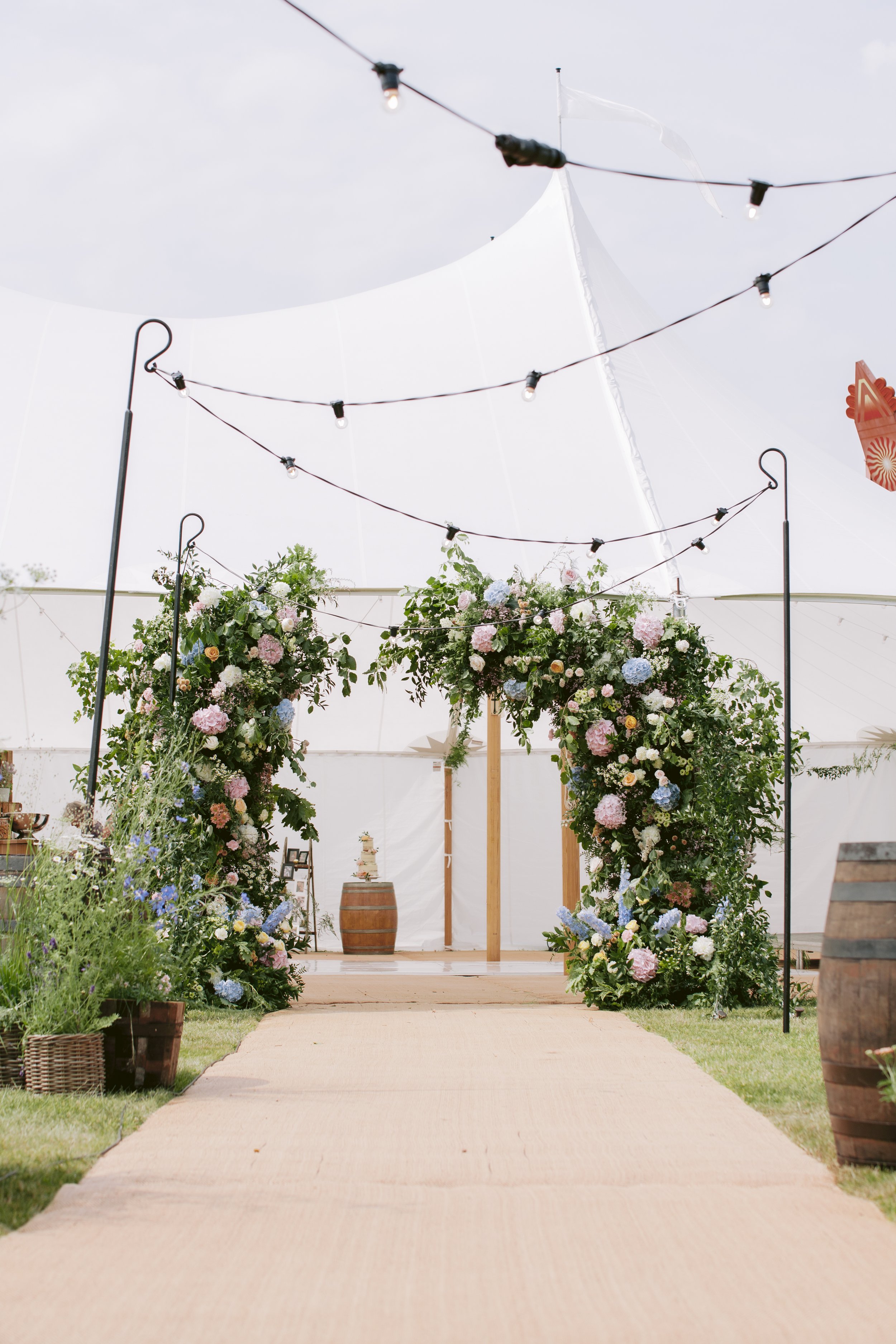 wedding backdrop flowers UK with garden style floral installation
