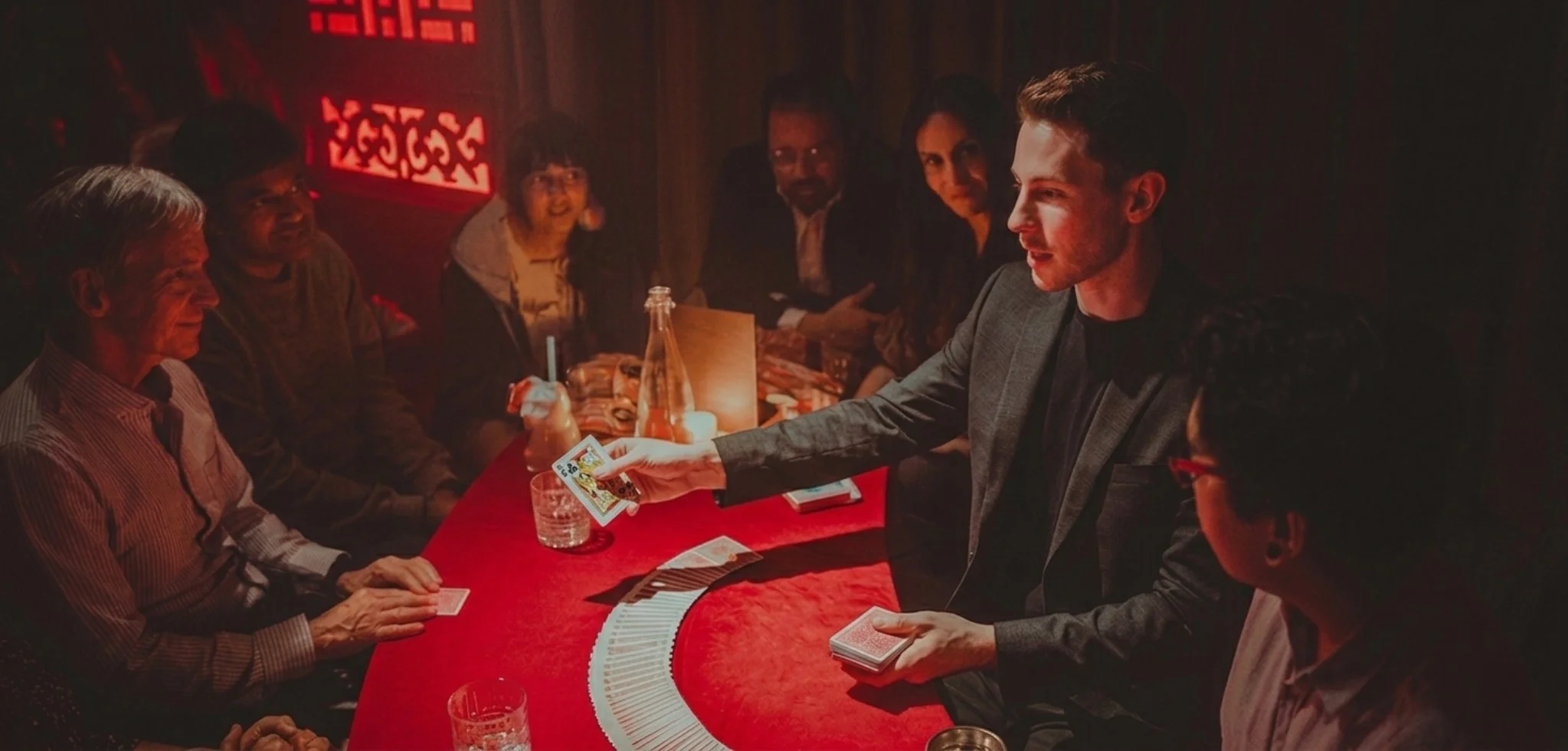 Toronto Magician Dylan Ballingall performing a private magic show at a restaurant
