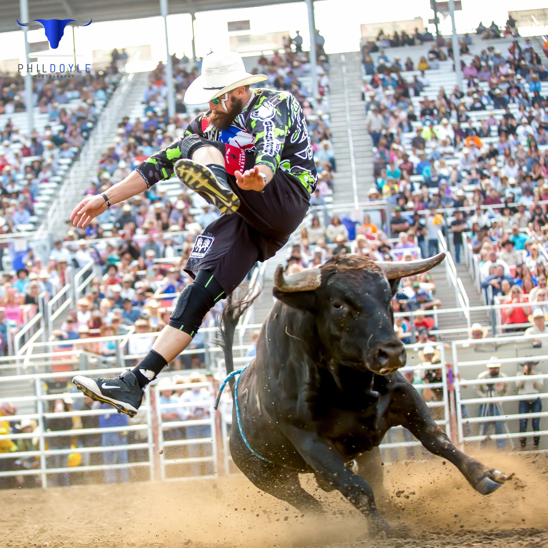 Weston Rutkowski 4x BFO World Champion freestyle bullfighter jumping over bull at professional rodeo — Founder of Bearded Elf Co. Granbury Texas